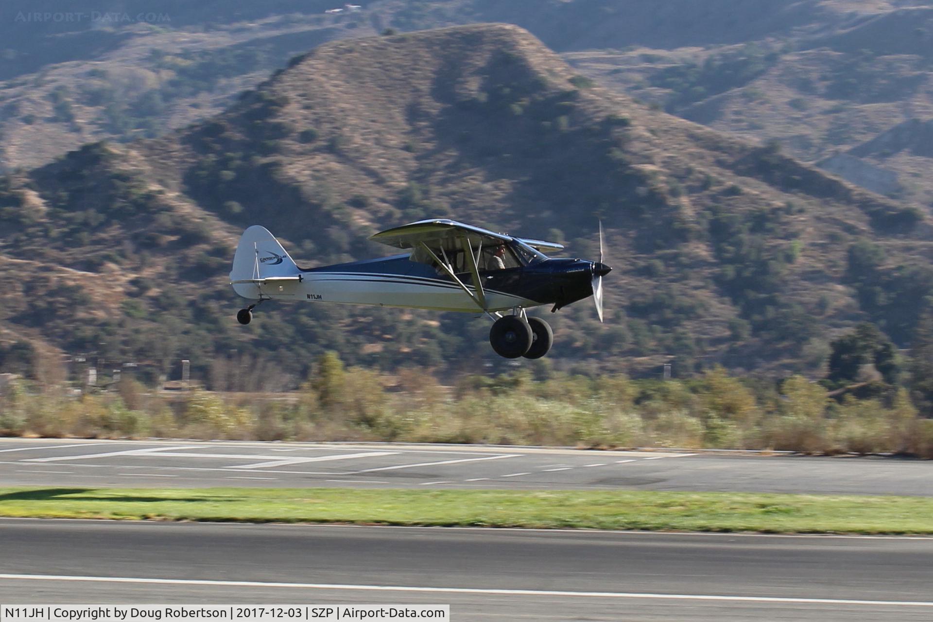 N11JH, 2016 Cub Crafters CC11-160 Carbon Cub SS C/N CC11-00415, 2016 CubCrafters CC11-160 CARBON CUB-SS, Titan OX-340CC 160 Hp, tundra tires, on final for initial STOL landing Rwy 22L grass