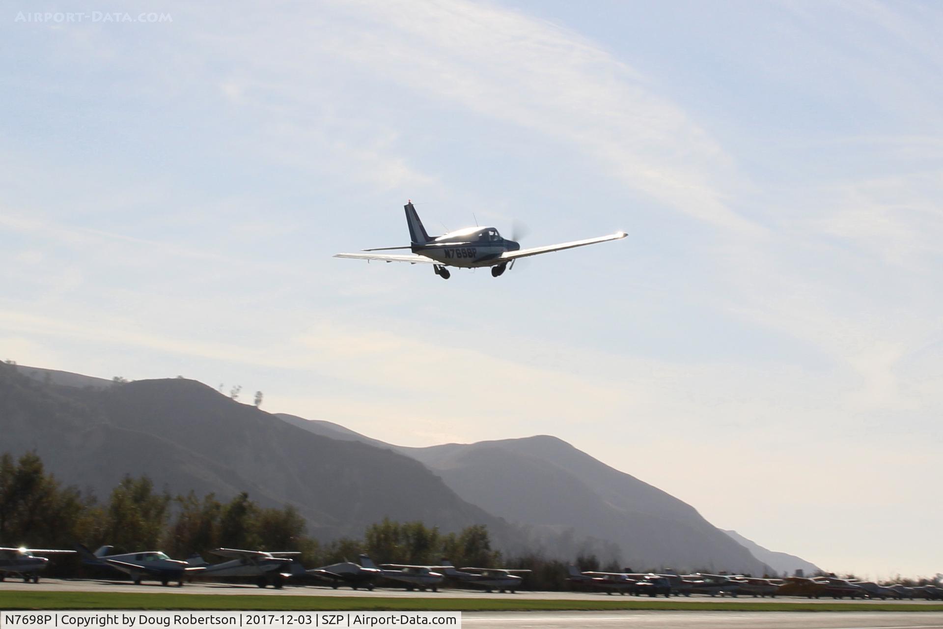 N7698P, 1961 Piper PA-24-250 Comanche C/N 24-2909, 1961 Piper PA-24-250 COMANCHE, Lycoming IO-540 250 Hp, quick takeoff climb Rwy 22, landing gear almost up.