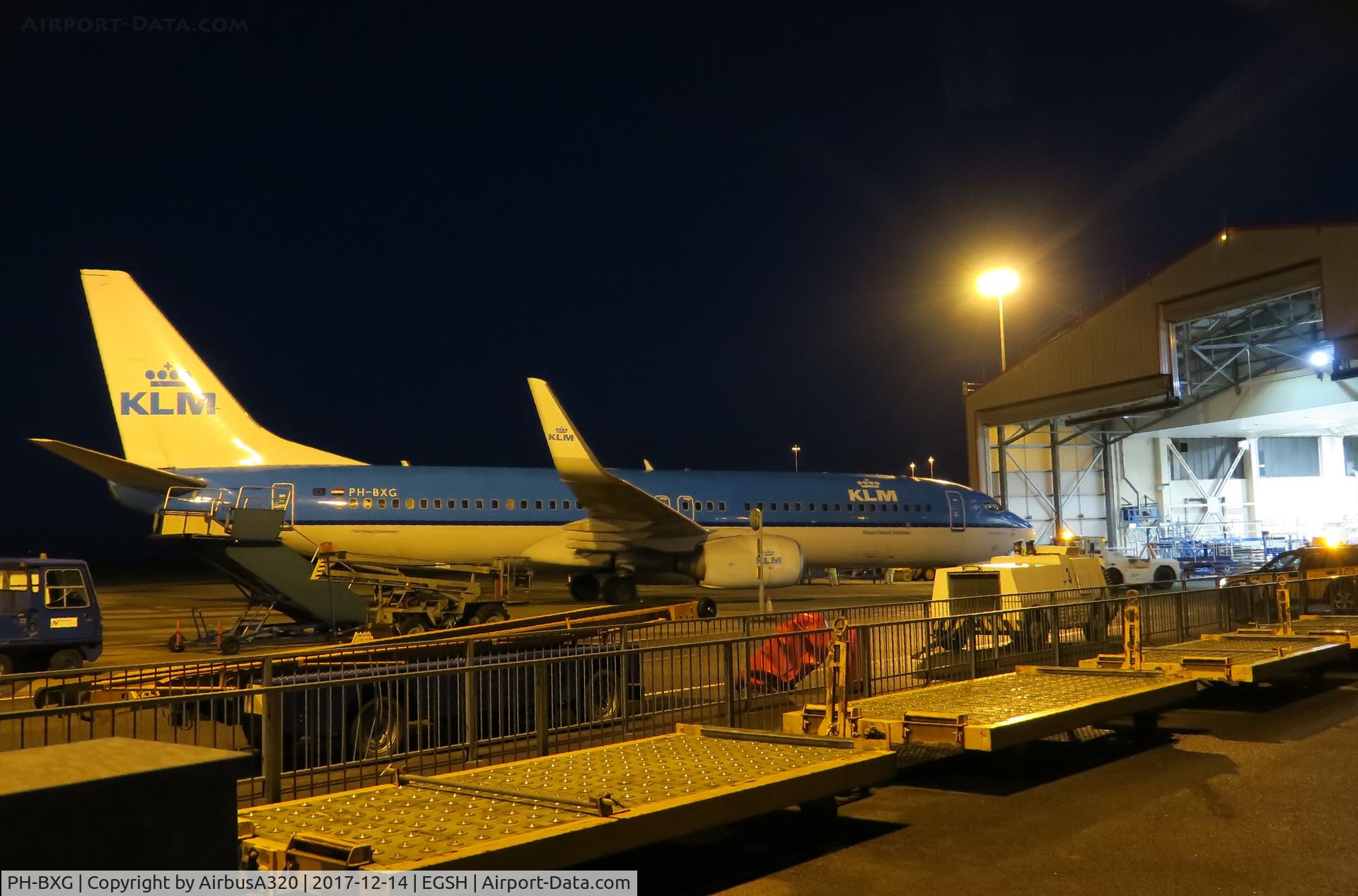 PH-BXG, 2000 Boeing 737-8K2 C/N 30357, Towing a 737 into Hangar 3 at Norwich across 2 stands with all  the airport equipment parked in the way