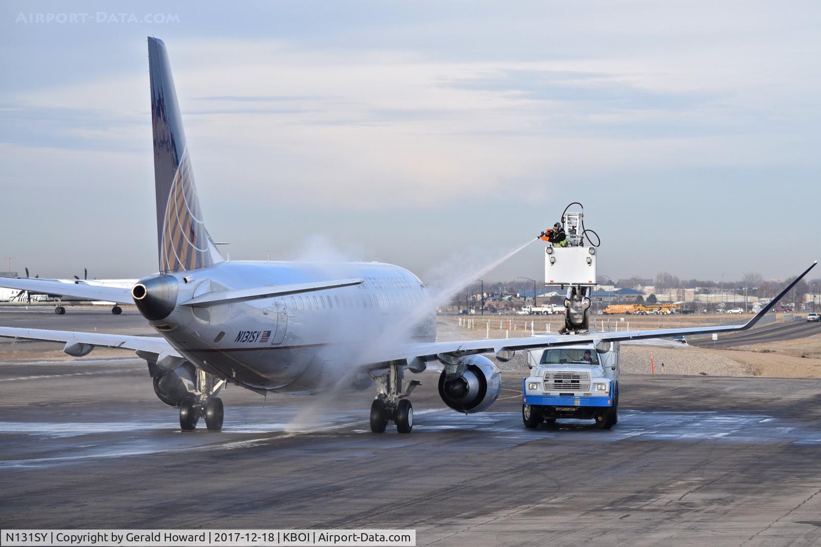 N131SY, 2015 Embraer 175LR (ERJ-170-200LR) C/N 17000450, Parked on west de ice pad being de iced.