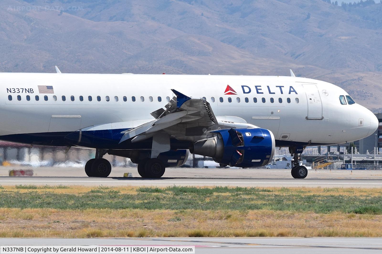 N337NB, 2002 Airbus A319-114 C/N 1685, Landing roll out with reverse thrusters working.