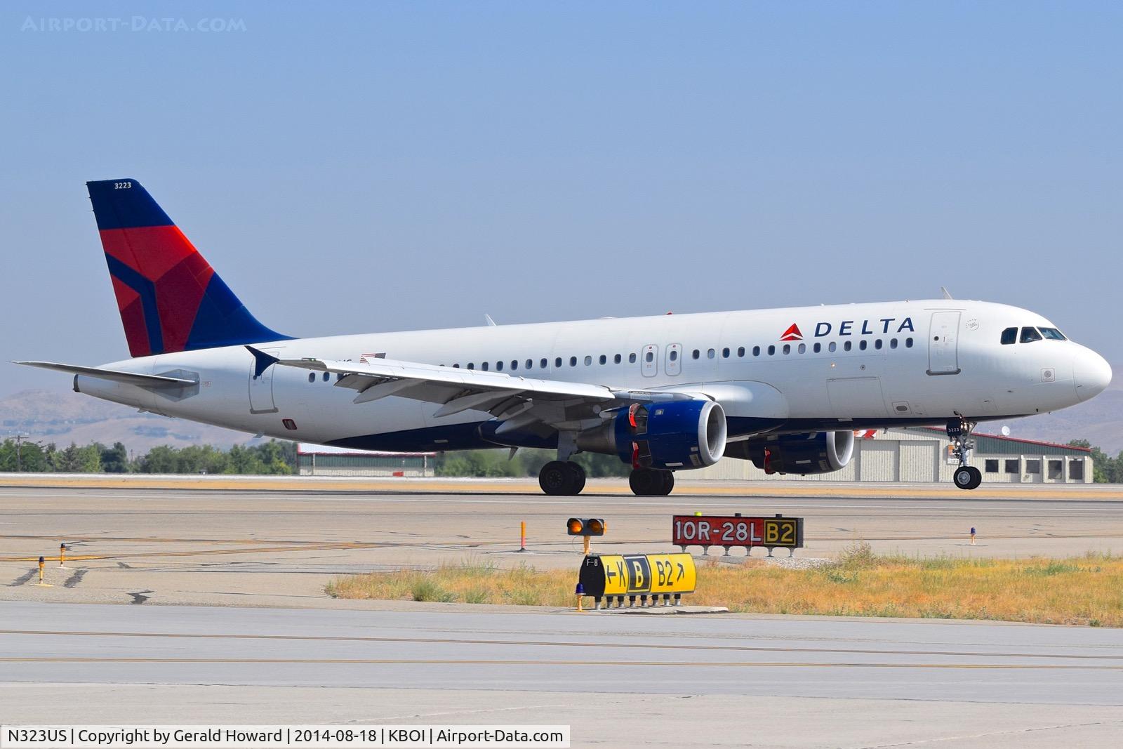 N323US, 1992 Airbus A320-211 C/N 272, Reverse thrusters are out before the nose wheel is down.