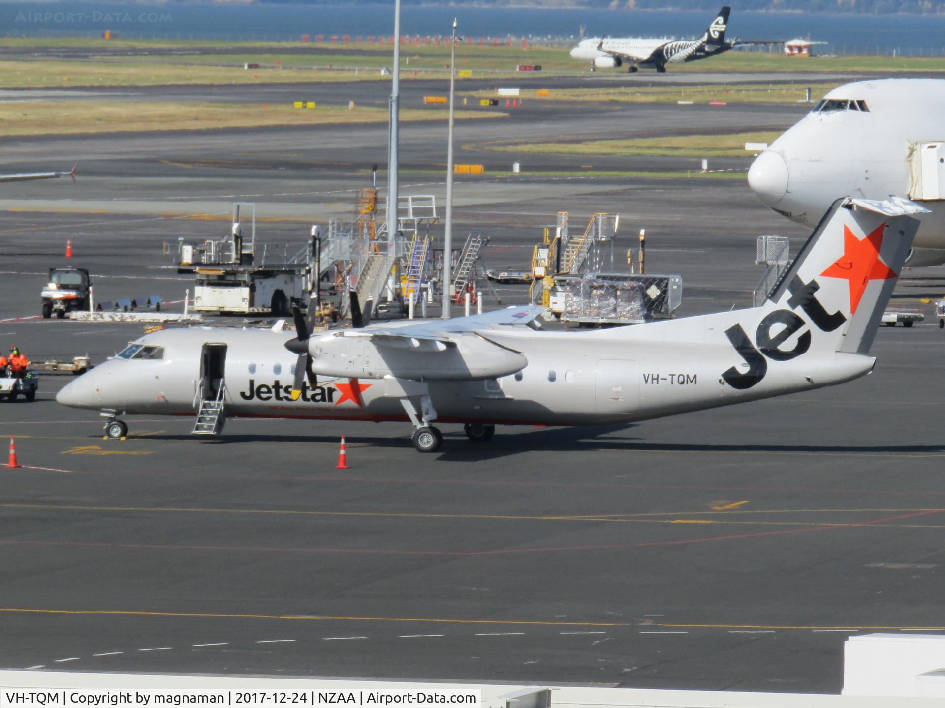 VH-TQM, 2004 De Havilland Canada DHC-8-315Q Dash 8 C/N 604, at akl -frpm car park