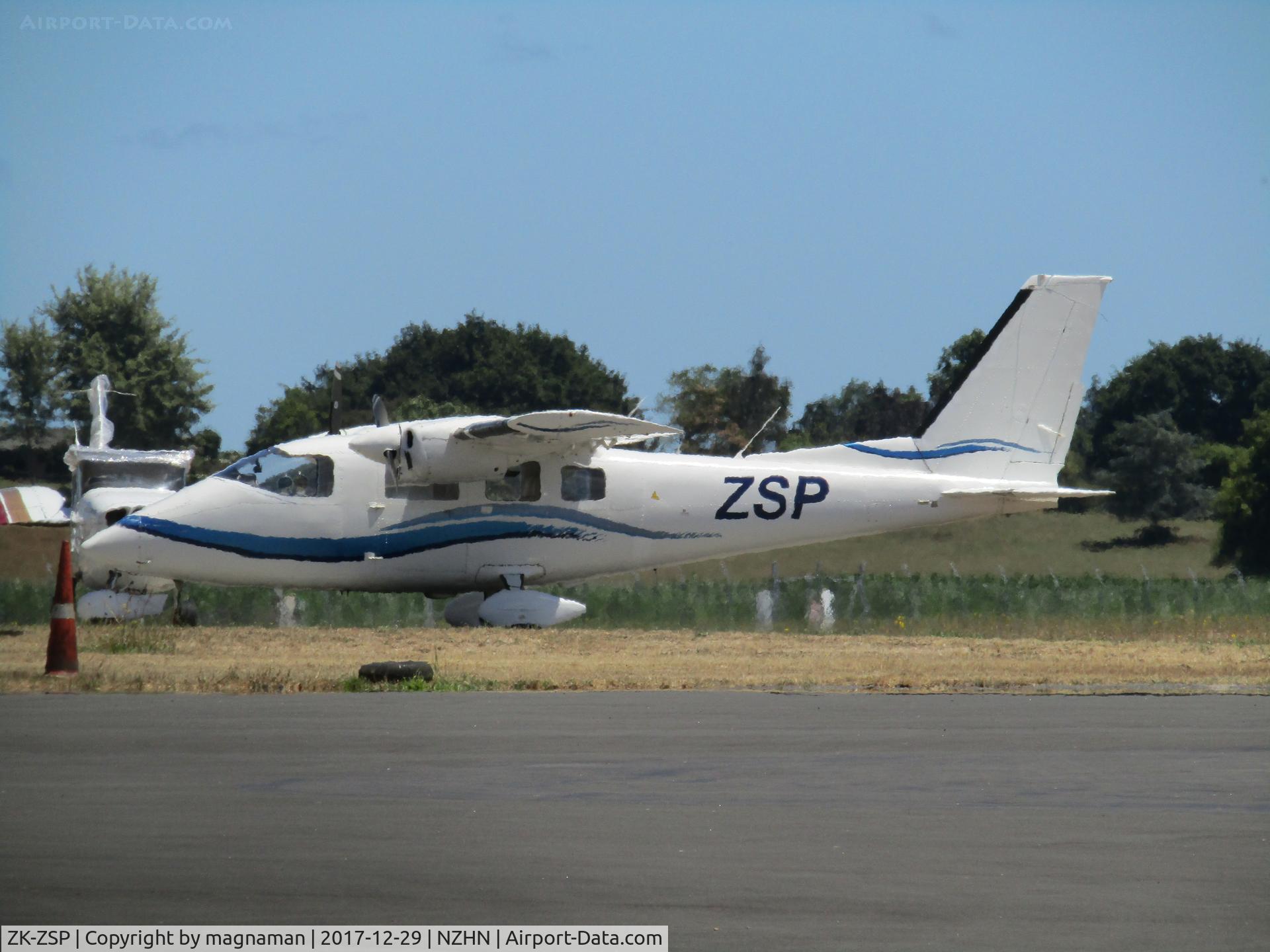 ZK-ZSP, 1978 Partenavia P-68B C/N 129, long shot on hazy hot day at hamilton