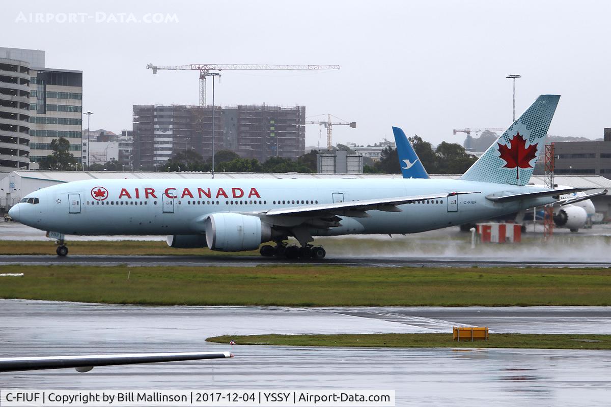 C-FIUF, 2007 Boeing 777-233/LR C/N 35243, ROLLING ON A WET 16R