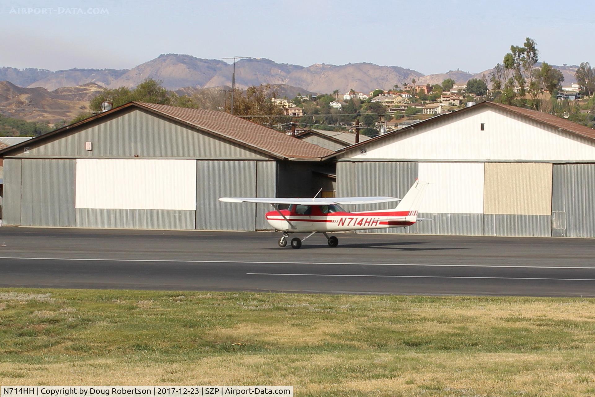 N714HH, 1977 Cessna 150M C/N 15079185, 1977 Cessna 150M, Continental O-200 100 Hp, taxi to Rwy 04. Note smoky sky to the left from the Thomas Fire now in its 19th day.