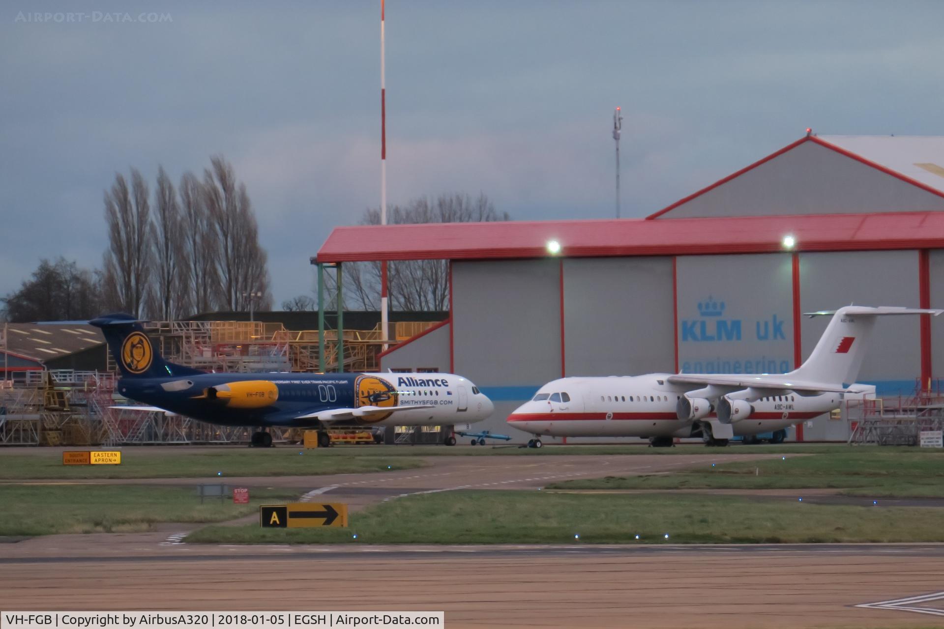 VH-FGB, 1993 Fokker 100 (F-28-0100) C/N 11446, Seen outside KLM hangars at Norwich with Bahrain Defence Avro RJ A9C-AWL