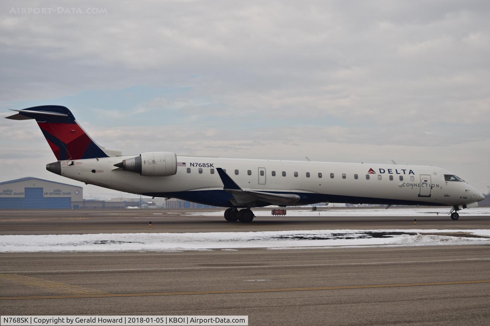 N768SK, 2005 Bombardier CRJ-701ER (CL-600-2C10) Regional Jet C/N 10234, On Alpha turing into the ramp.