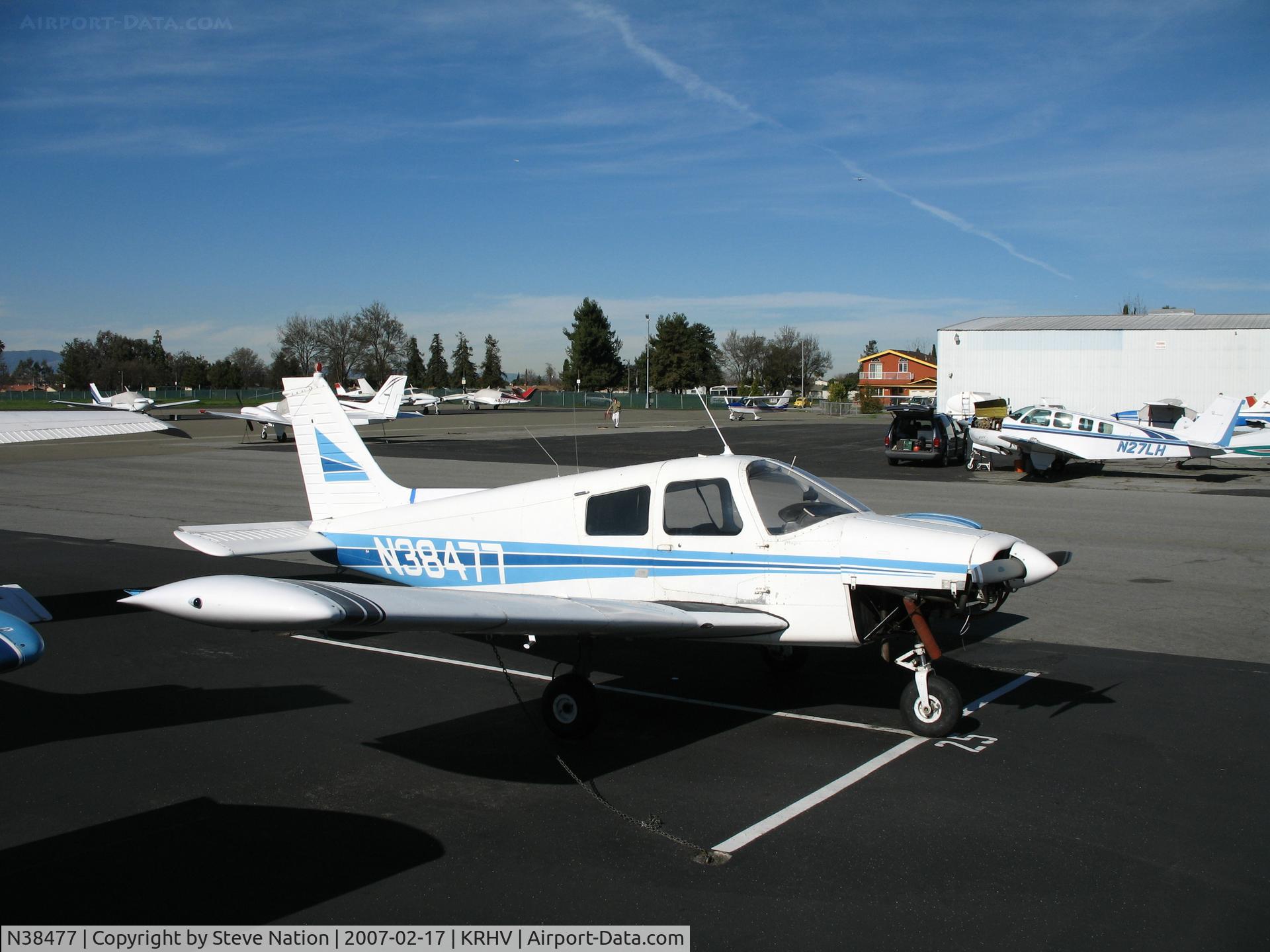 N38477, 1977 Piper PA-28-140 Cherokee C/N 28-7725282, Nice Air 1977 Piper PA-28-140 minus lower cowling cover @ Reid-Hillview Airport (San Jose), CA home base