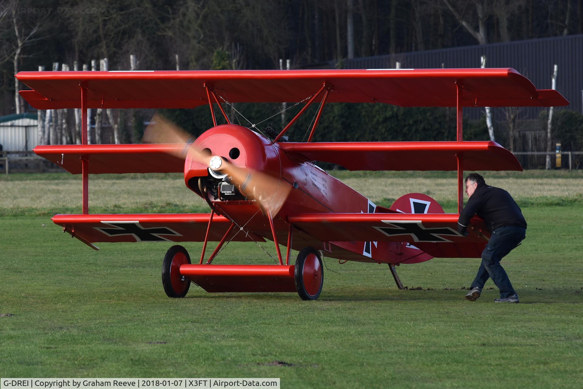 G-DREI, 2011 Fokker Dr.1 Triplane Replica C/N LAA 238-14848, Just landed at Felthorpe.
