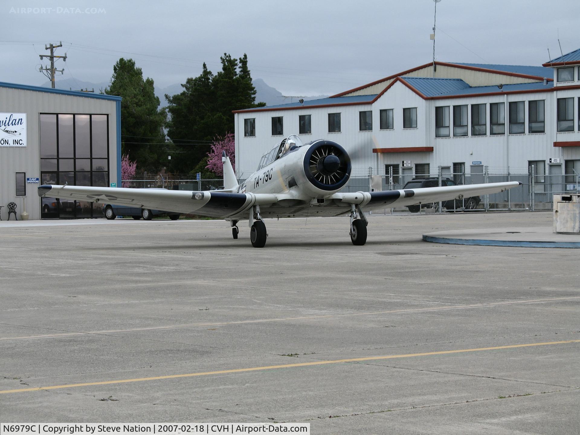 N6979C, North American AT-6D Texan C/N 42-85408, North American AT-6D in USAF c/s with TA-79C code taxiing in for fuel @ Hollister Municipal Airport, CA