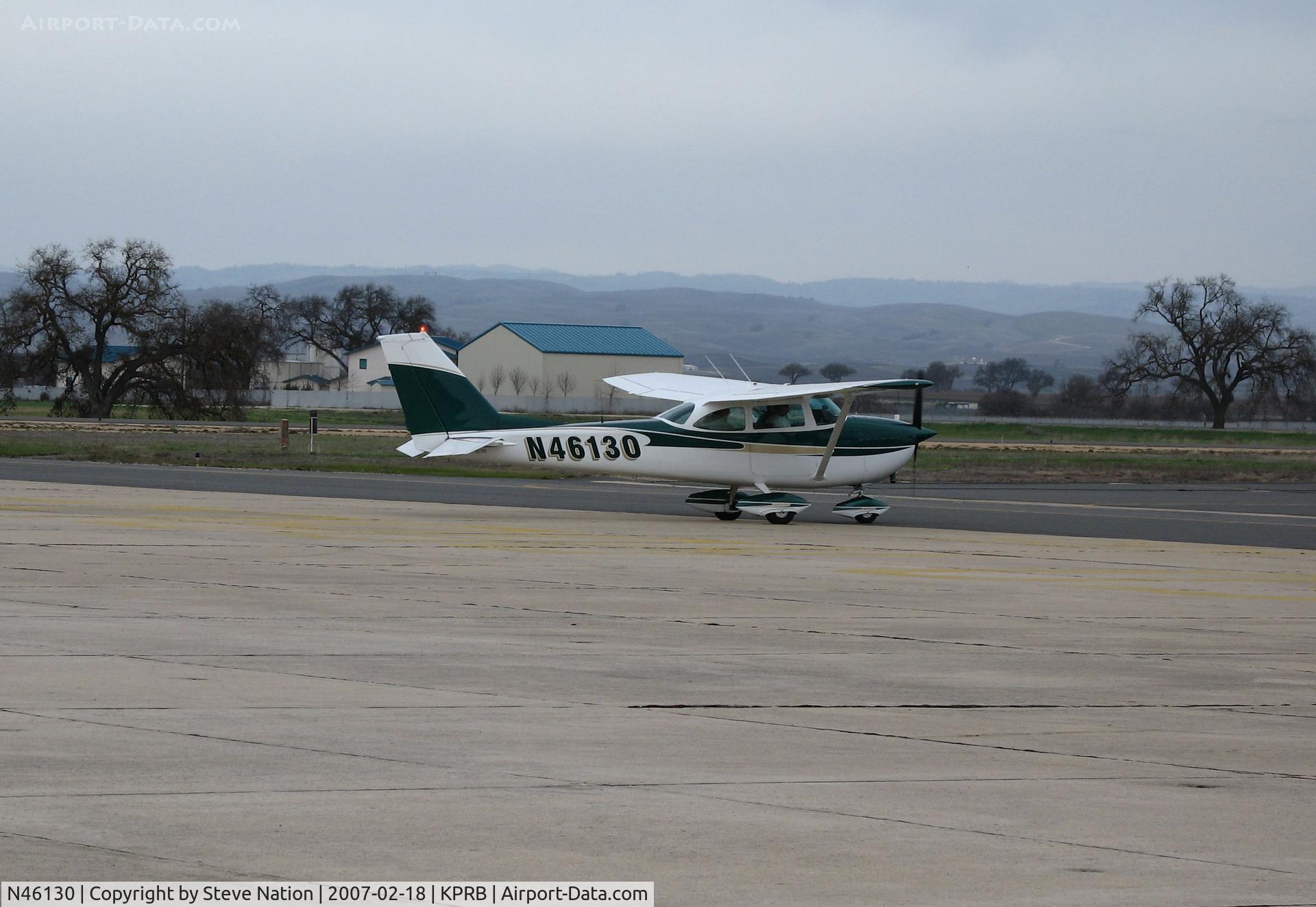 N46130, 1968 Cessna 172I C/N 17257061, Sharp looking 1968 Cessna 172L Skylane taxiing with valley oaks and CALFIRE air tanker base in background @ Paso Robles Municipal Airport, CA