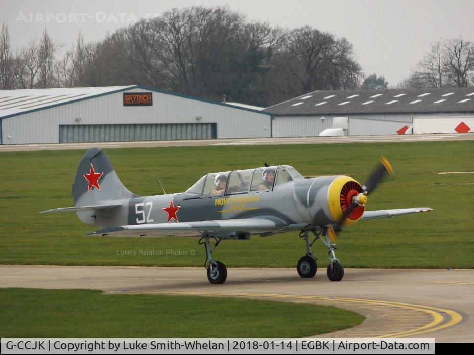 G-CCJK, 1996 Yakovlev (Aerostar) Yak-52 C/N 9612001, Going to the apron to park.
