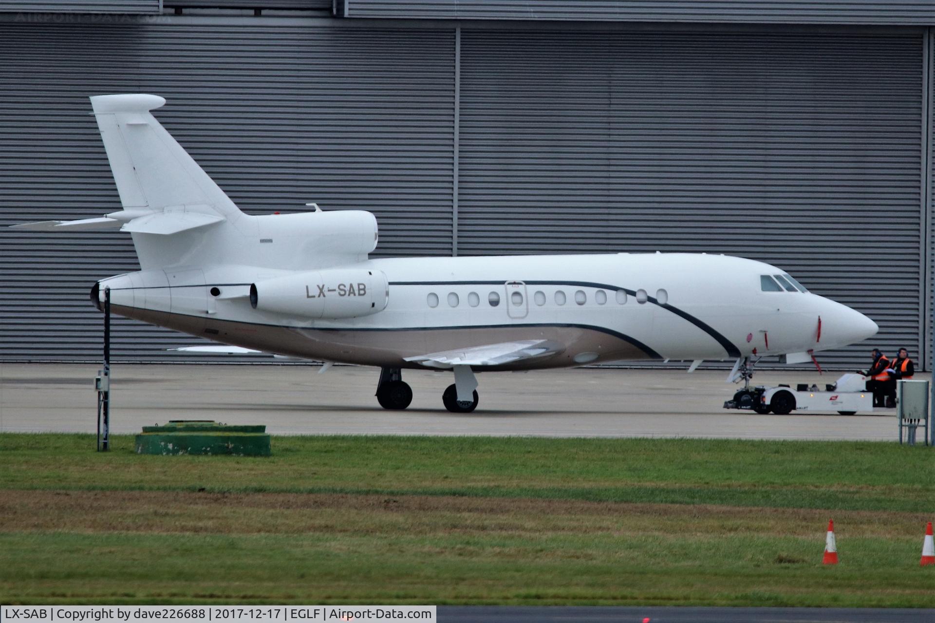 LX-SAB, 2008 Dassault Falcon 900DX C/N 619, LX SAB being towed out of hanger at Farnborough