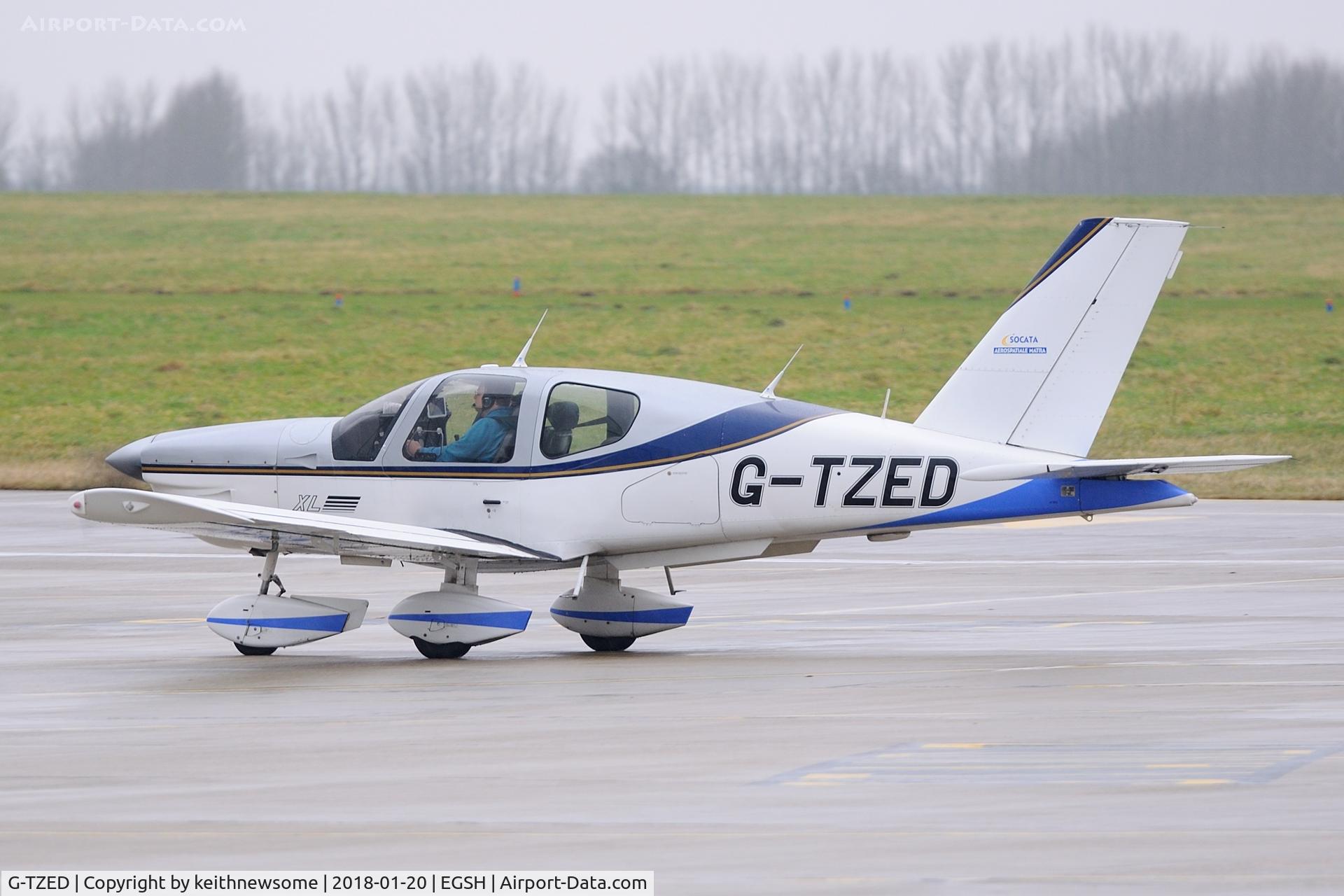 G-TZED, 1997 Socata TB-200 Tobago XL C/N 1813, Arriving at Norwich in rain.