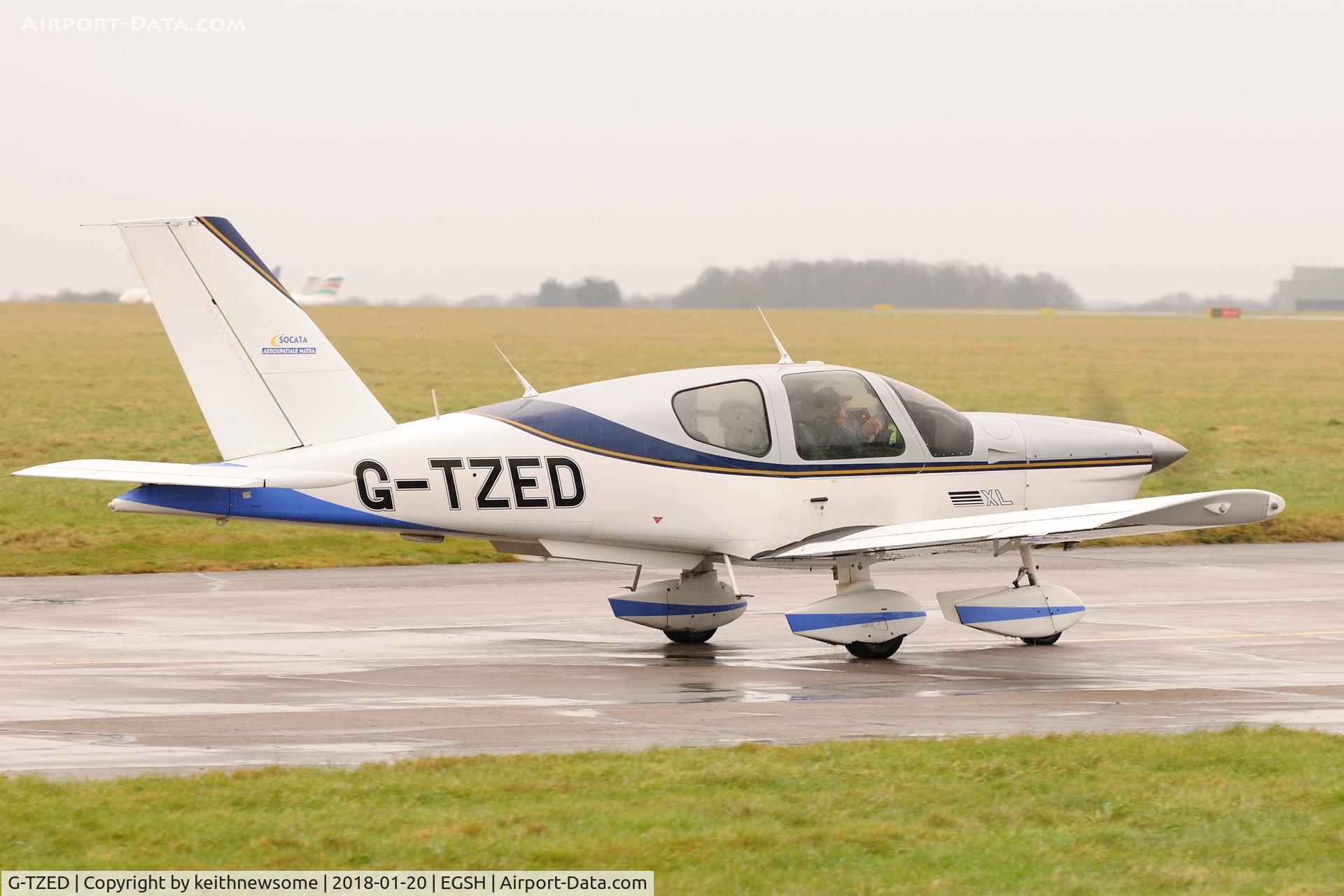 G-TZED, 1997 Socata TB-200 Tobago XL C/N 1813, Leaving Norwich in rain.