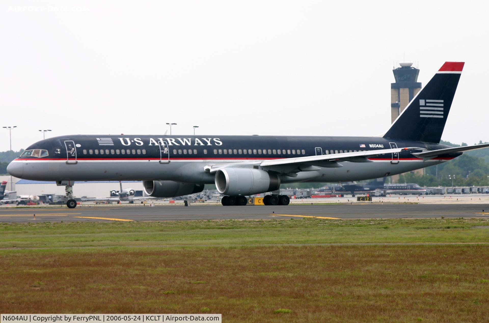 N604AU, 1999 Bombardier Challenger 604 (CL-600-2B16) C/N 5434, US Airways B752 about to depart CLT