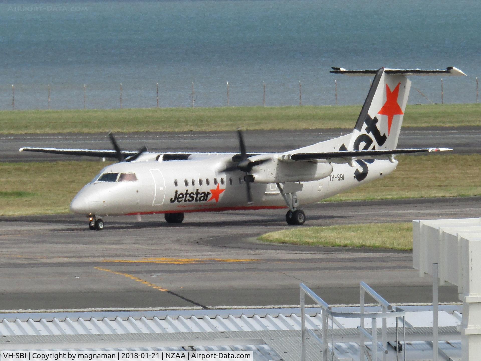 VH-SBI, 2004 De Havilland Canada DHC-8-315Q Dash 8 C/N 605, turning off runway