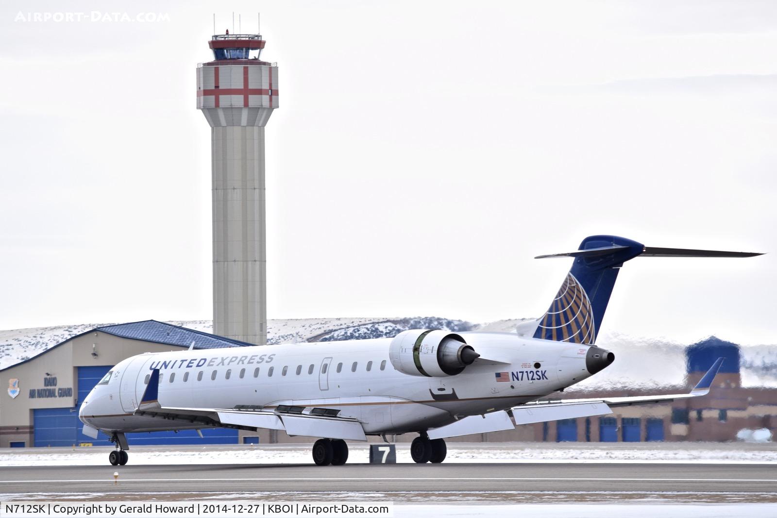 N712SK, 2004 Bombardier CRJ-700 (CL-600-2C10) Regional Jet C/N 10172, Landing roll out on RWY 10L.