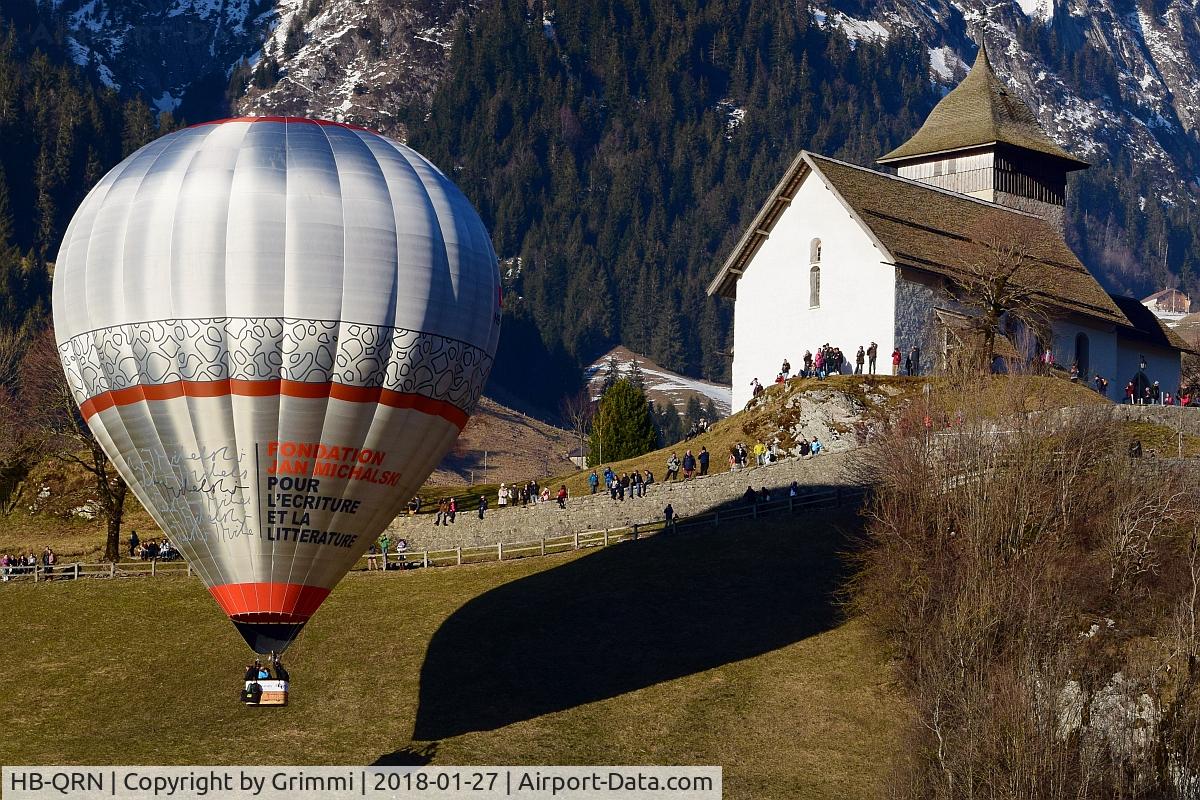 HB-QRN, 2013 UltraMagic M-160 C/N 160/69, with the nice chapelle of Château d'Oex, during 40th Festival International de Ballons