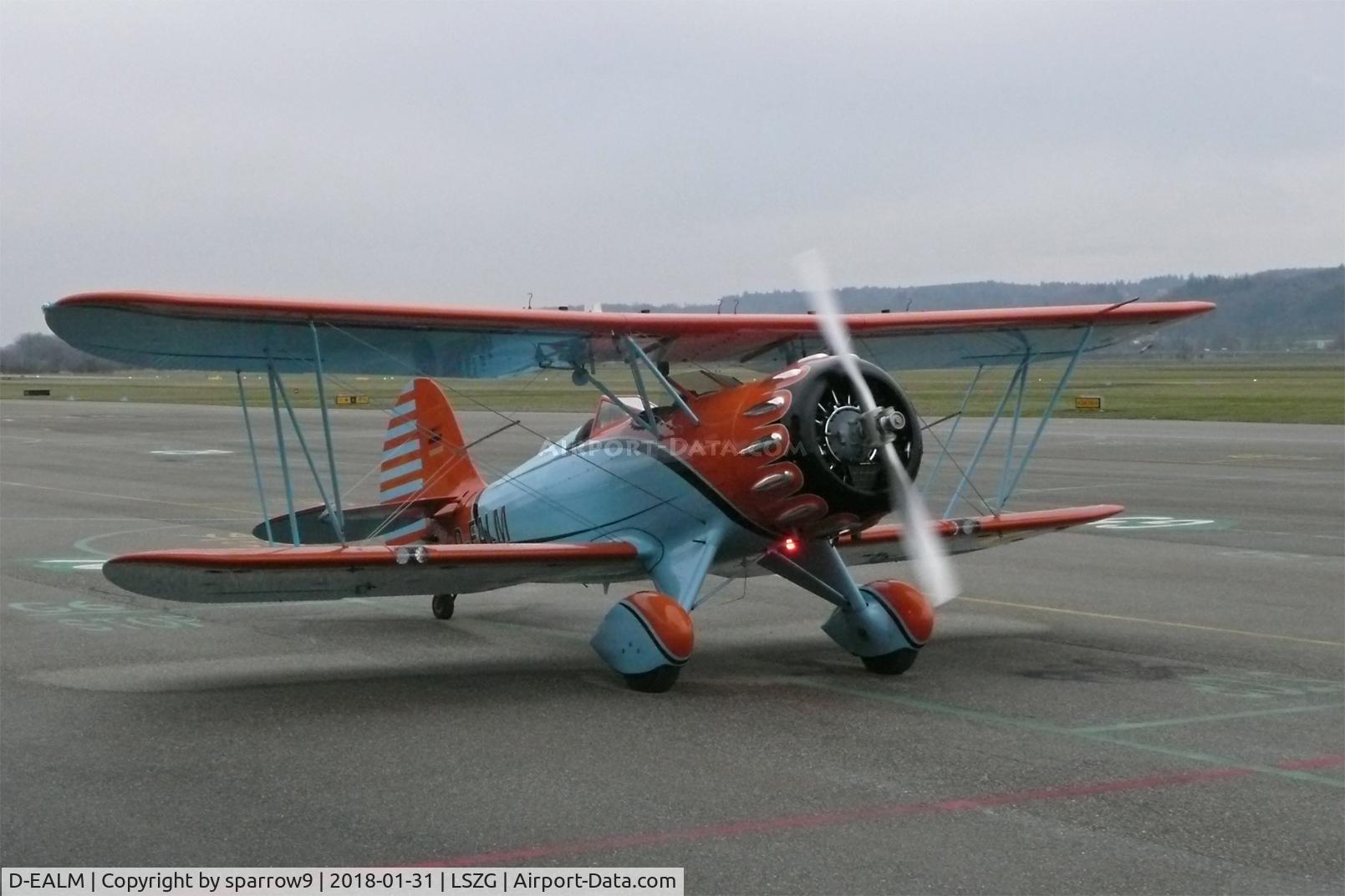D-EALM, 2010 Waco YMF-F5C C/N F5C-8-123, It must be rather refreshing in an open biplane in winter. Ready to taxi at Grenchen.