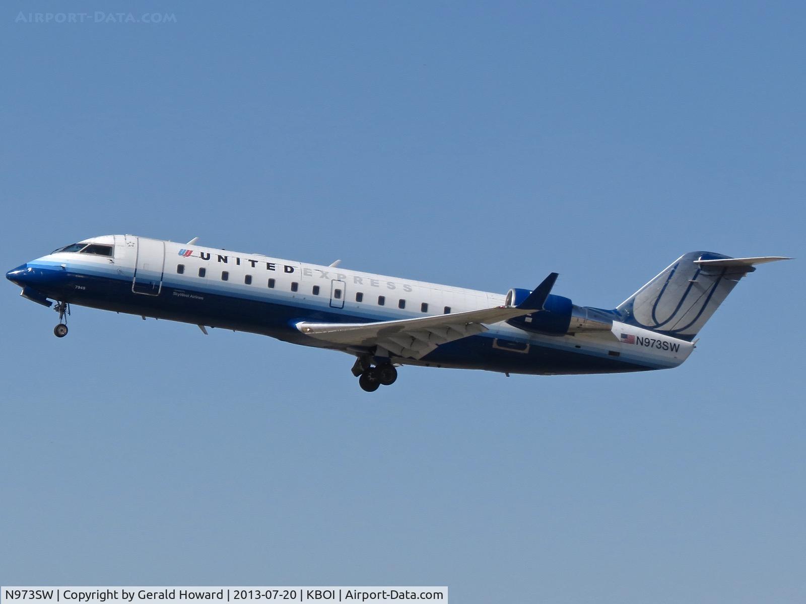 N973SW, 2004 Bombardier CRJ-200ER (CL-600-2B19) C/N 7949, Departing BOI.