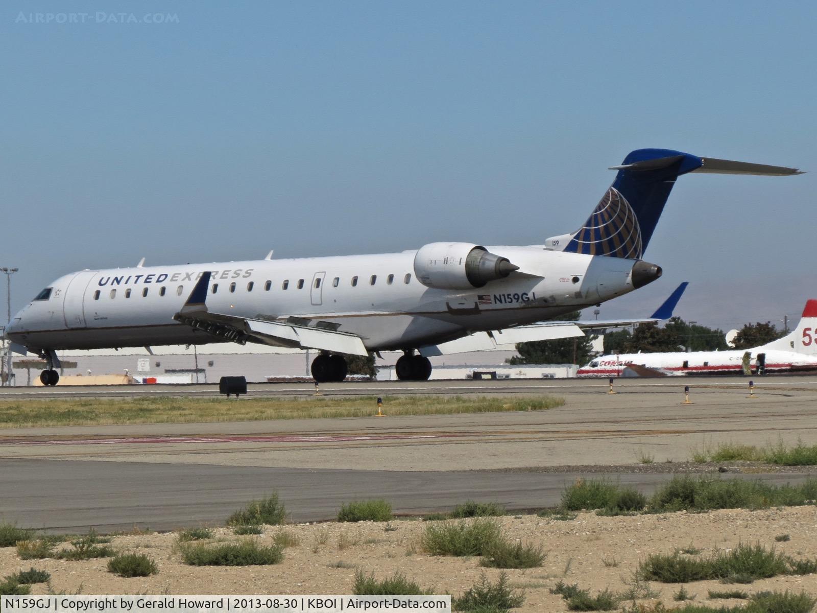 N159GJ, 2005 Bombardier CRJ-702 (CL-600-2C10) Regional Jet C/N 10238, Landing roll out on RWY 28R.