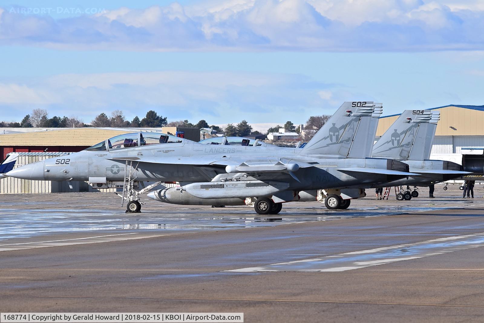 168774, Boeing EA-18G Growler C/N G-88, Two EA-18Gs from VAQ-131 “Lancers”, CVN-77, USS George H.W. Bush parked on the south GA ramp for a fuel stop.