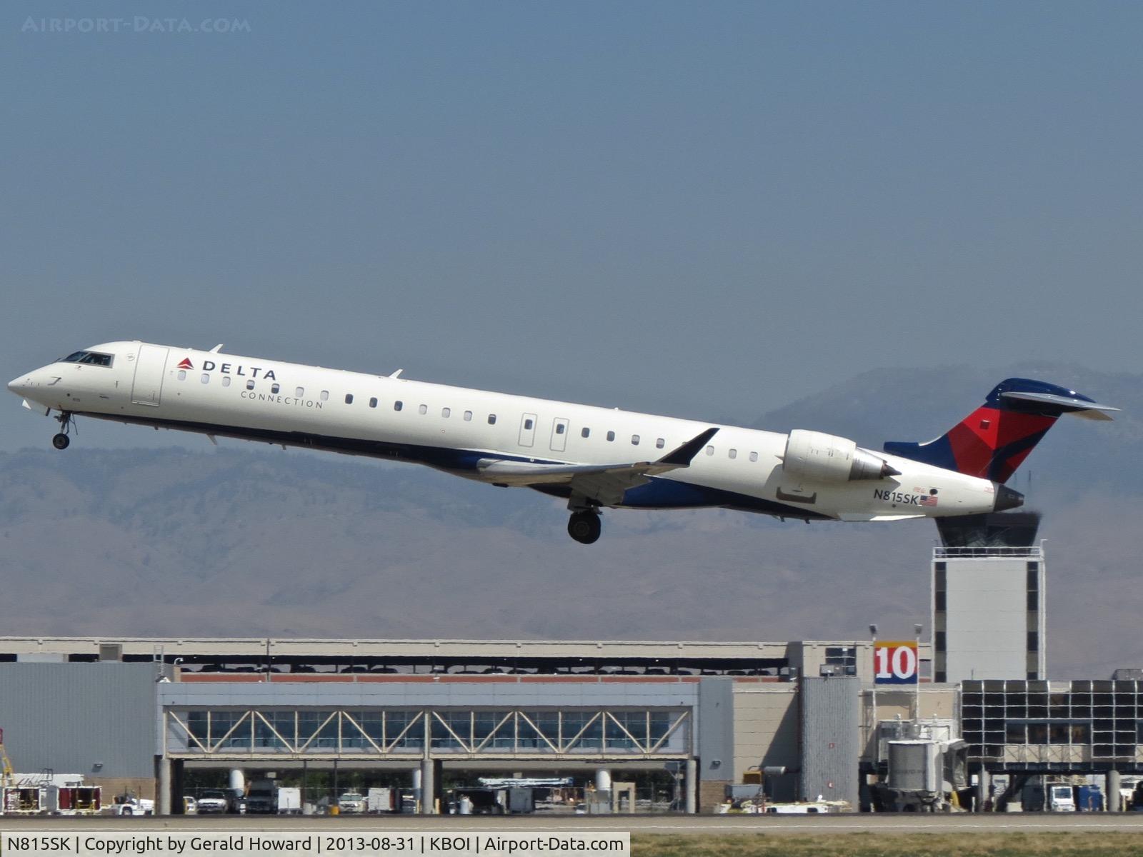 N815SK, 2006 Bombardier CRJ-900ER (CL-600-2D24) C/N 15101, Departing RWY 28R.