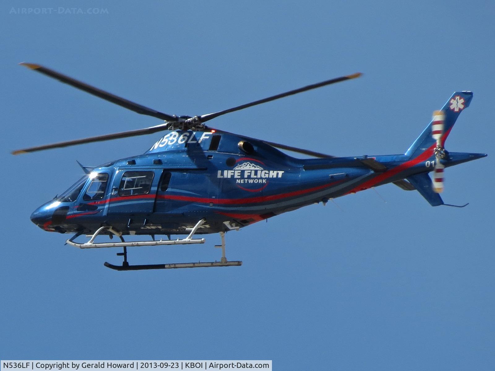 N536LF, 2012 AgustaWestland AW-119 MKII Koala C/N 14801, Flying across both runways to Life Flight ramp.