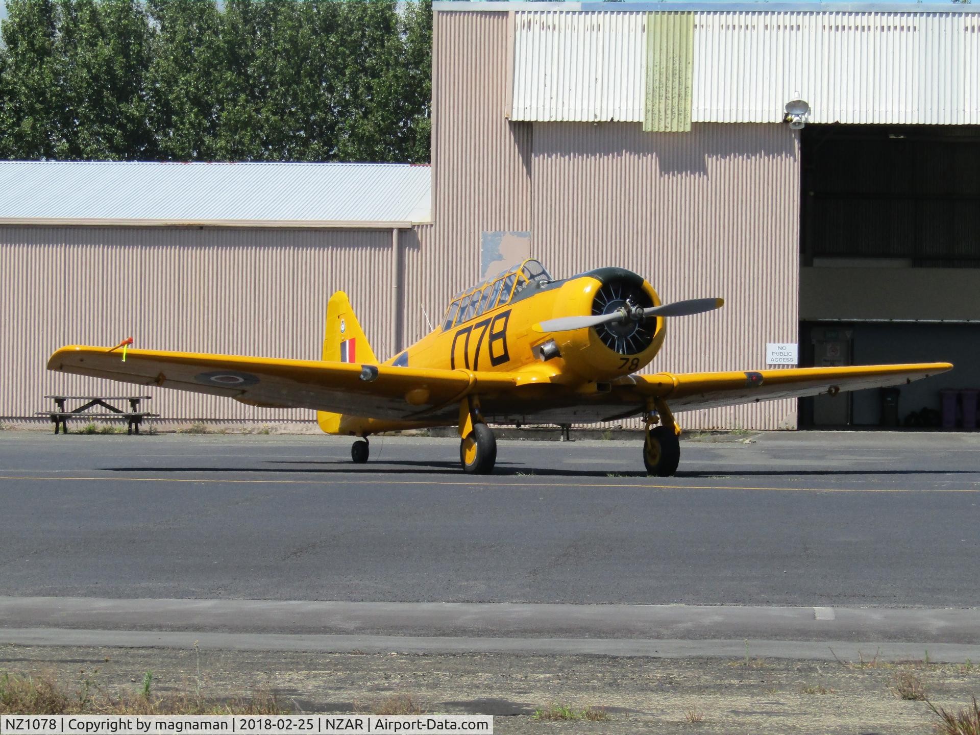 NZ1078, 1941 North American AT-6D Harvard III C/N 88-15873 (41-34119), sun always brings these out of museum hangar