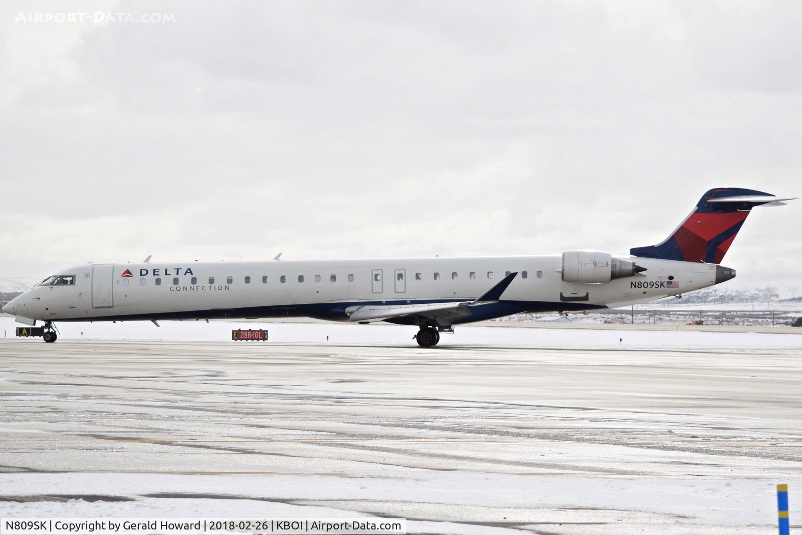 N809SK, 2006 Bombardier CRJ-900ER (CL-600-2D24) C/N 15086, Coming off RWY 28R for the gate.
