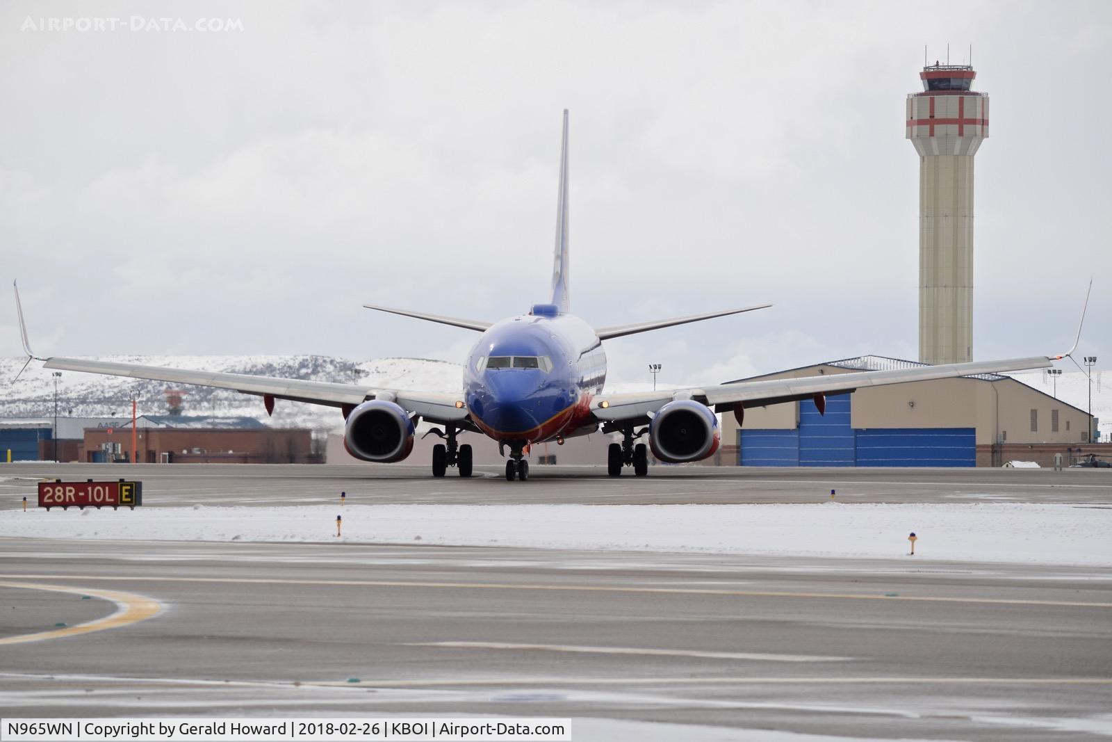 N965WN, 2011 Boeing 737-7H4 C/N 36677, Turning off RWY 28R onto Echo.