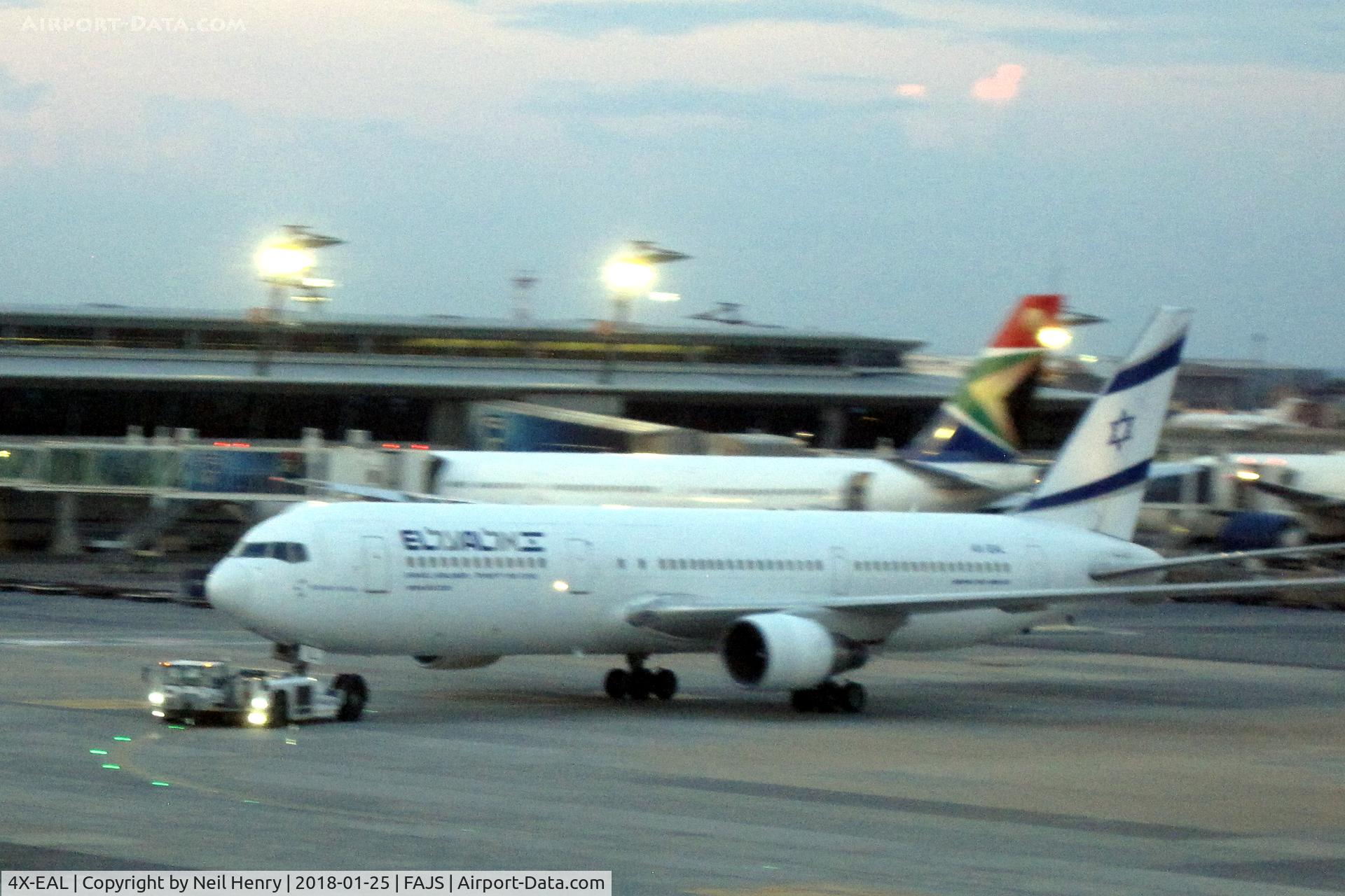 4X-EAL, 2000 Boeing 767-33A/ER C/N 27477, Seen from Terminal A at JNB in fading light (sorry!) around 7:30pm on 25 Jan 2018.  Aircraft under tow to the departure gate