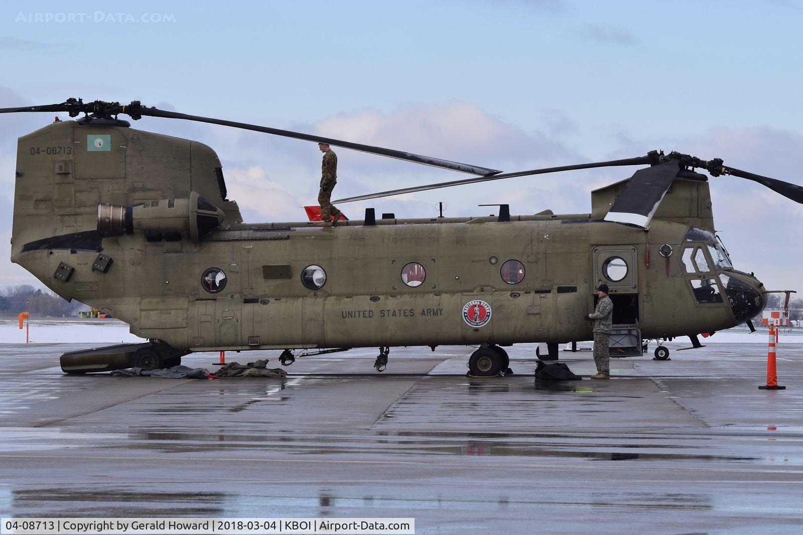 04-08713, 2004 Boeing CH-47F Chinook C/N M.8713, Parked on the north GA ramp. Doing a pre flight check.