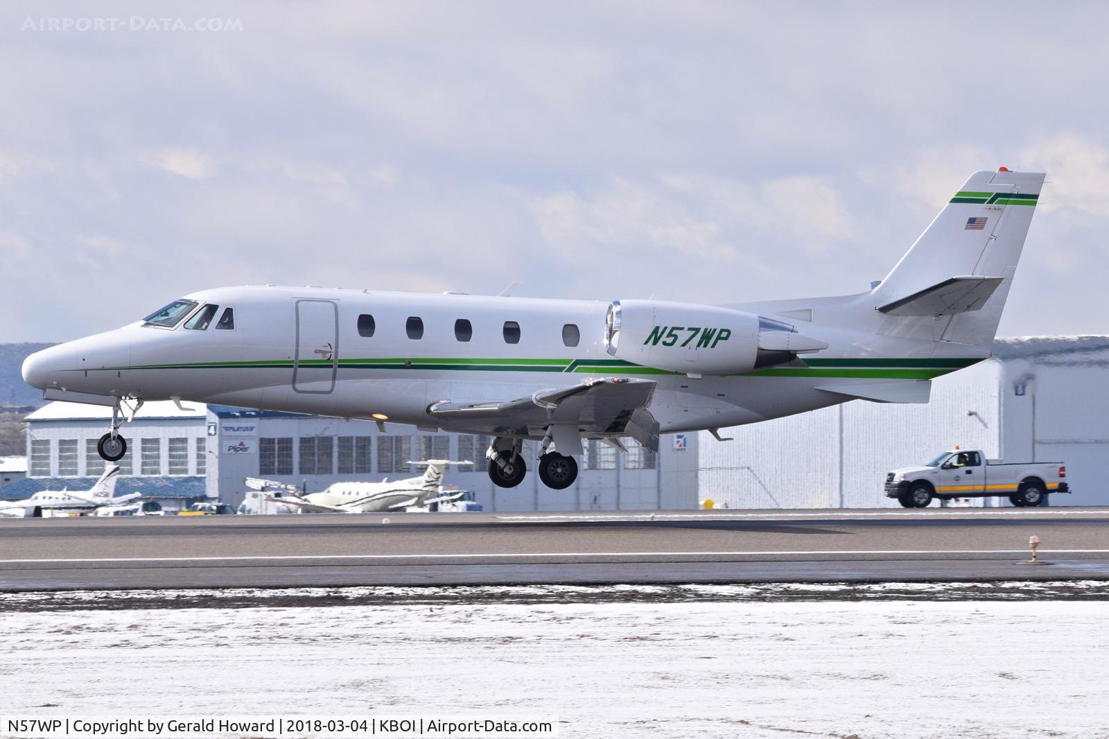 N57WP, 2003 Cessna 560XL Citation Excel C/N 560-5317, Landing RWY 10L. The truck is over on 10R.