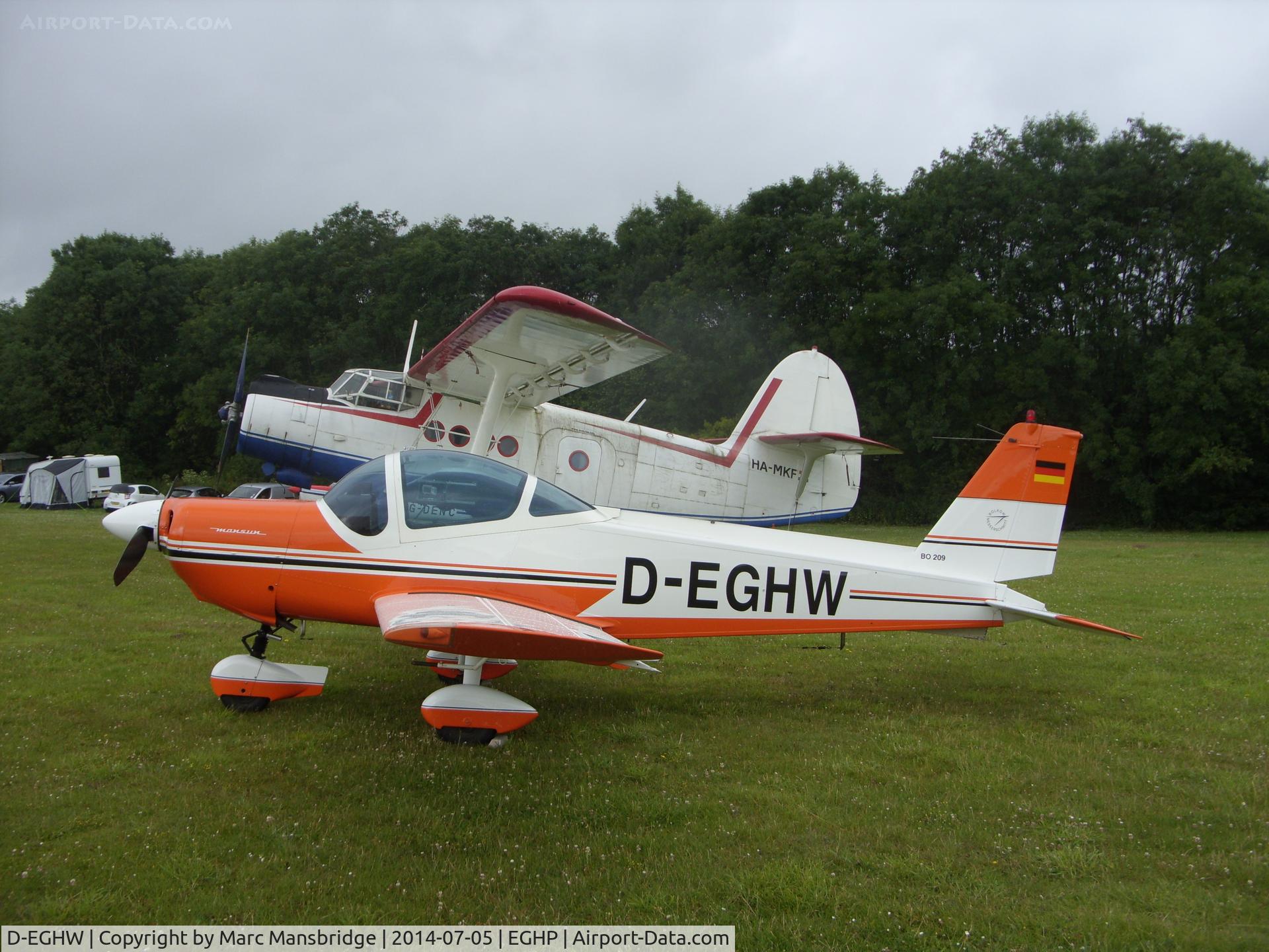 D-EGHW, 1984 Bolkow Bo-209 Monsun 150FV C/N 170, Parked at it's home at Popham airfield EGHP alongside HA-MKF, another of Popham's residents.