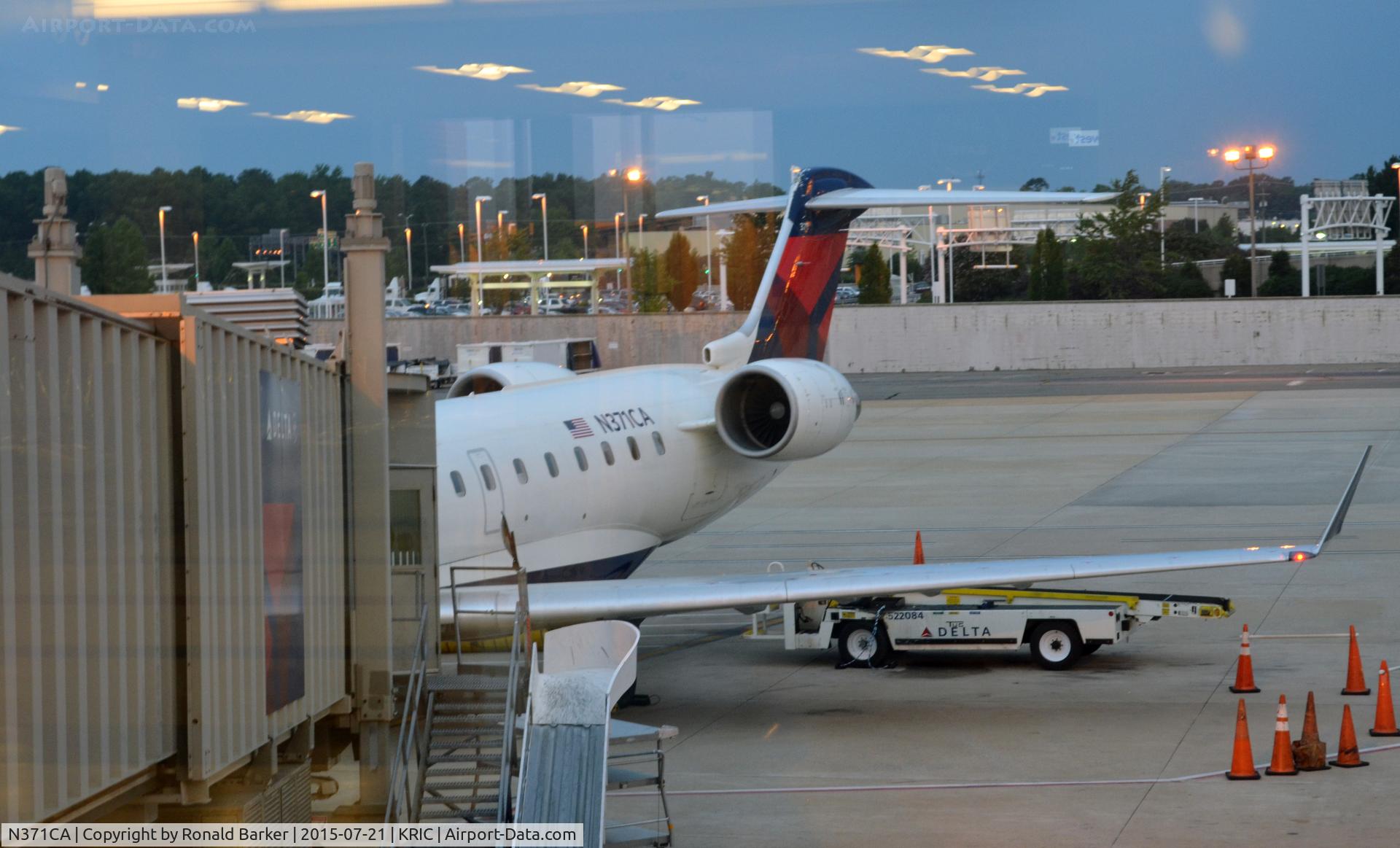 N371CA, 2003 Bombardier CRJ-701ER (CL-600-2C10) Regional Jet C/N 10082, On the ramp Richmond