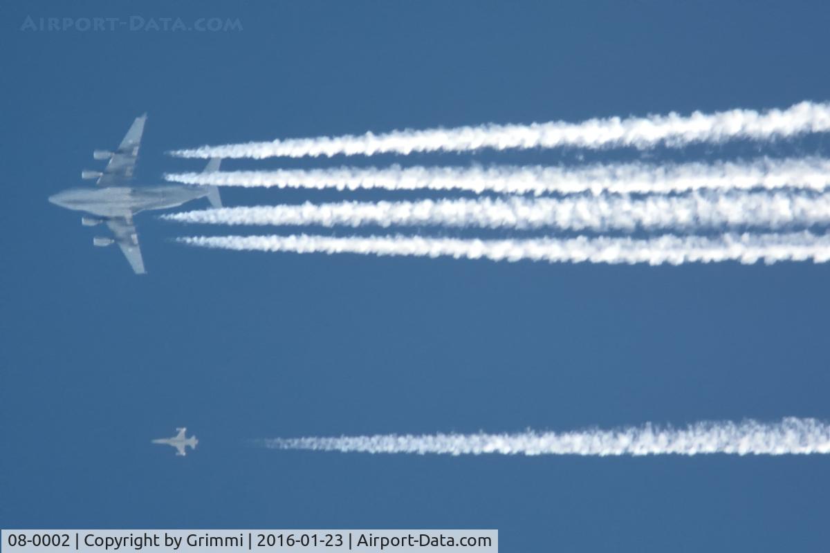 08-0002, 2009 Boeing C-17A Globemaster III C/N F-210, Meeting of an Swiss Air Force F-5E Tiger II with the Giant on 34'000ft. The Live ammunition is clearly visible (white Sidewinder), WEF 2016