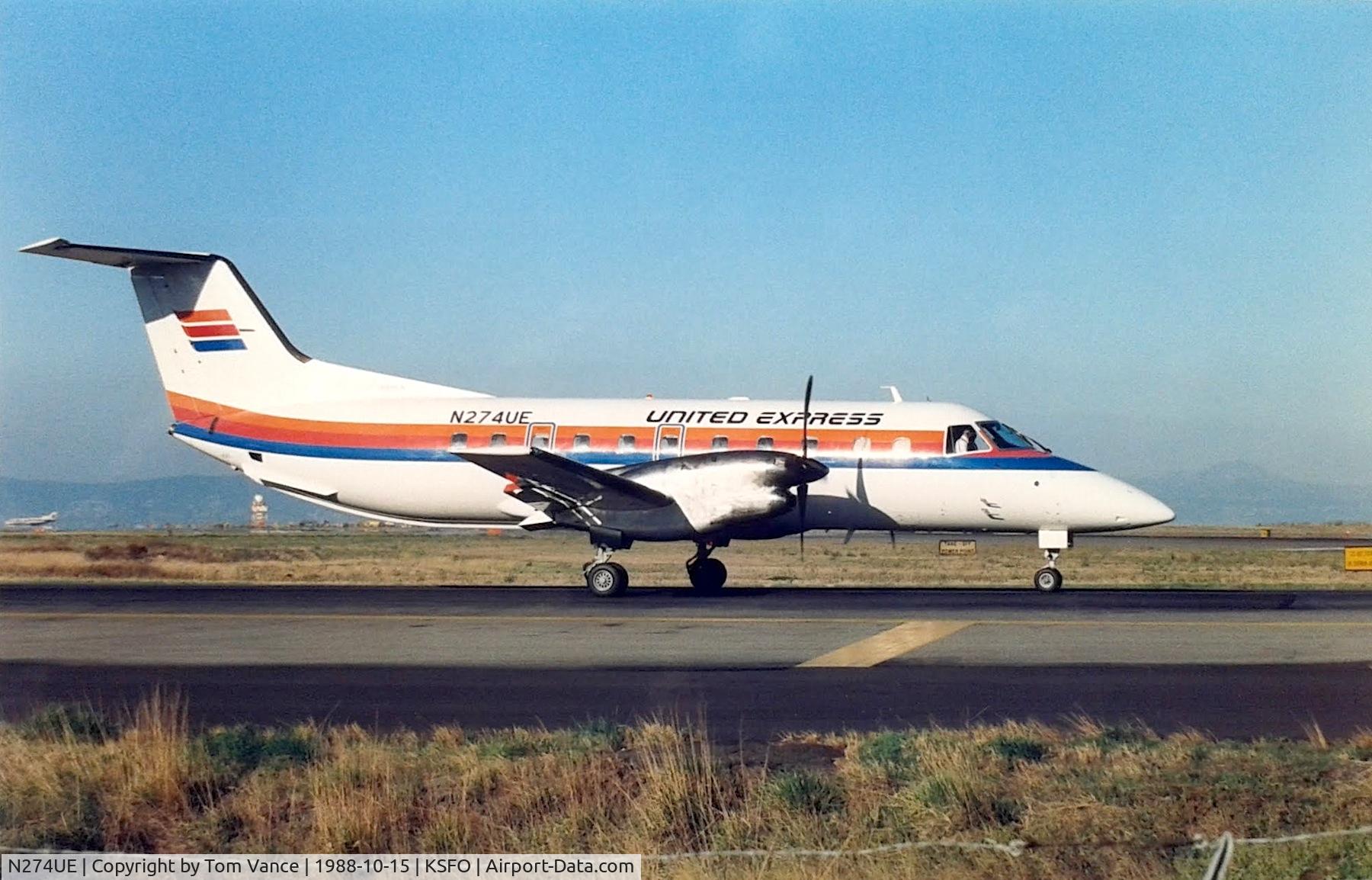 N274UE, 1987 Embraer EMB-120ER Brasilia C/N 120054, at SFO on taxi to Runway 1R.