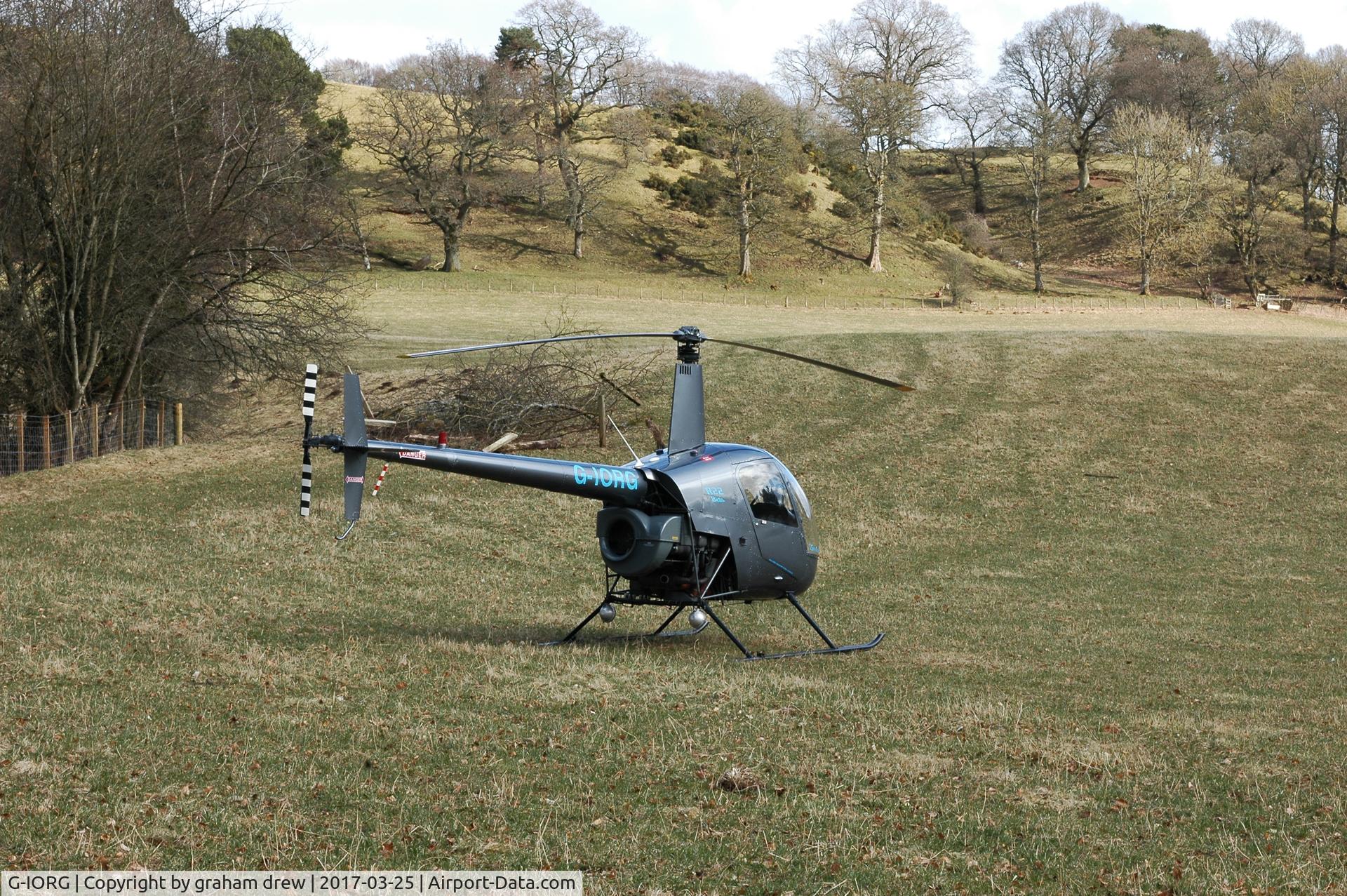 G-IORG, 1991 Robinson R22 Beta C/N 1679, seen in a field in Lanark