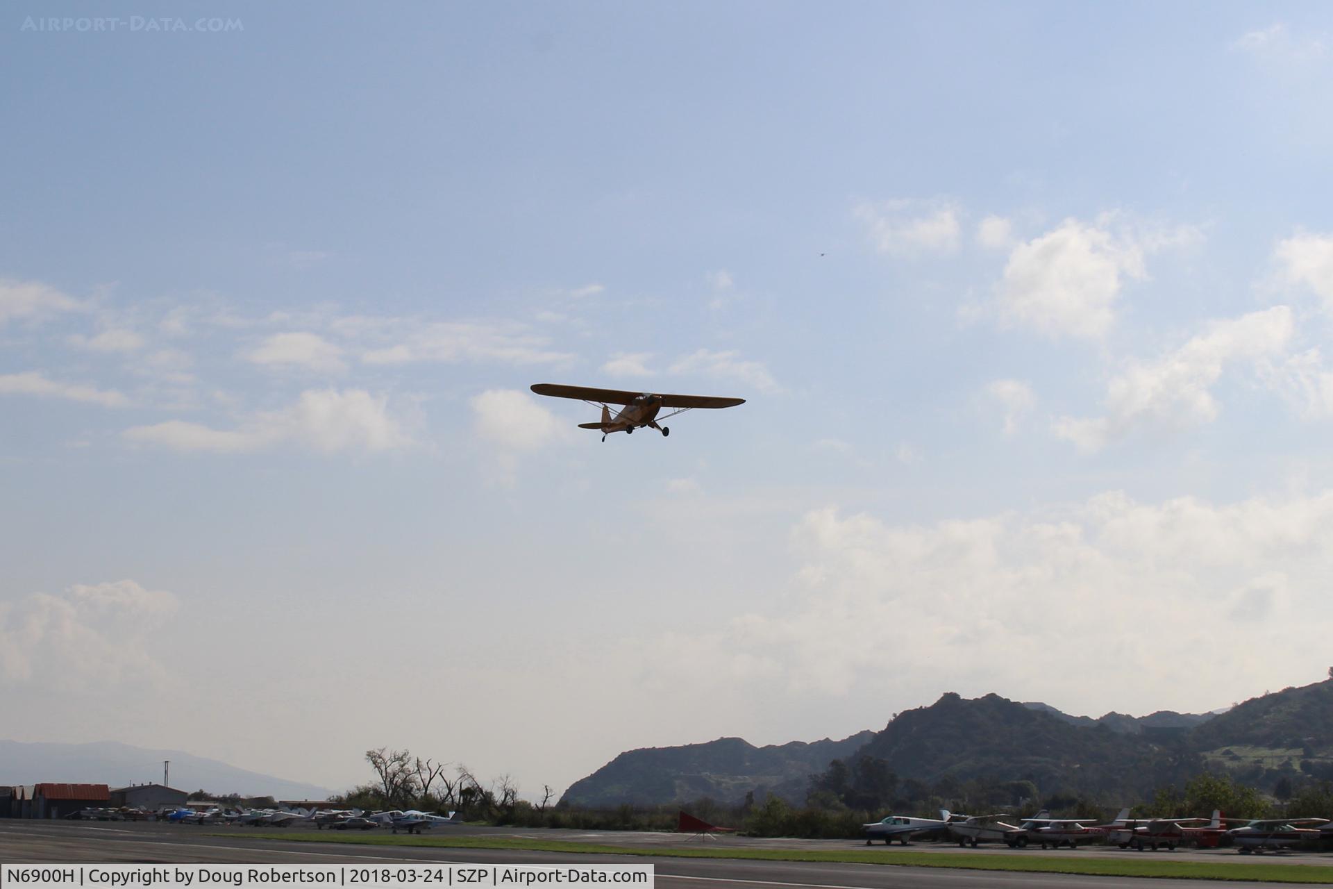 N6900H, 1946 Piper J3C-65 Cub Cub C/N 20129, 1946 Piper J3C-65 CUB, Lycoming O-290 135 Hp upgrade by STC, takeoff climb Rwy 22