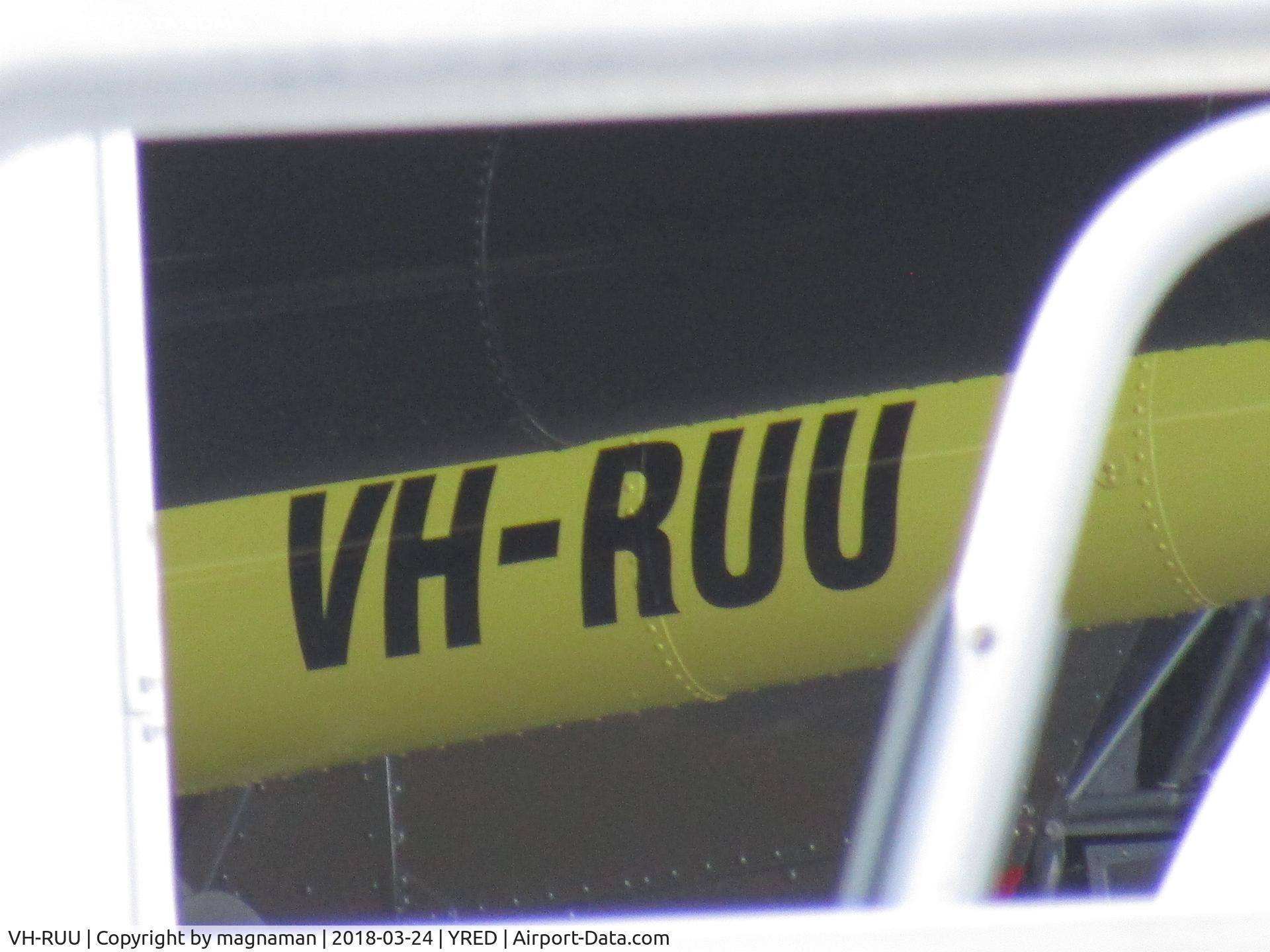 VH-RUU, 1989 Robinson R22 Beta C/N 1188, hiding amongst hangar clutter - not hopping about