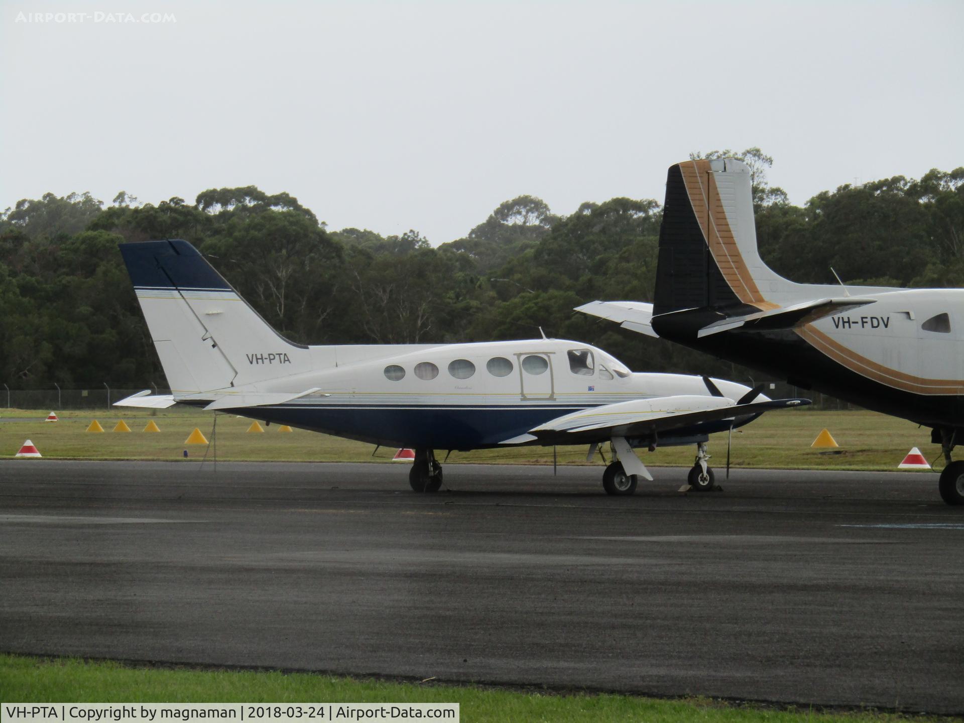 VH-PTA, 1979 Cessna 414A Chancellor C/N 414A0490, from between hangars - at Caloundra
