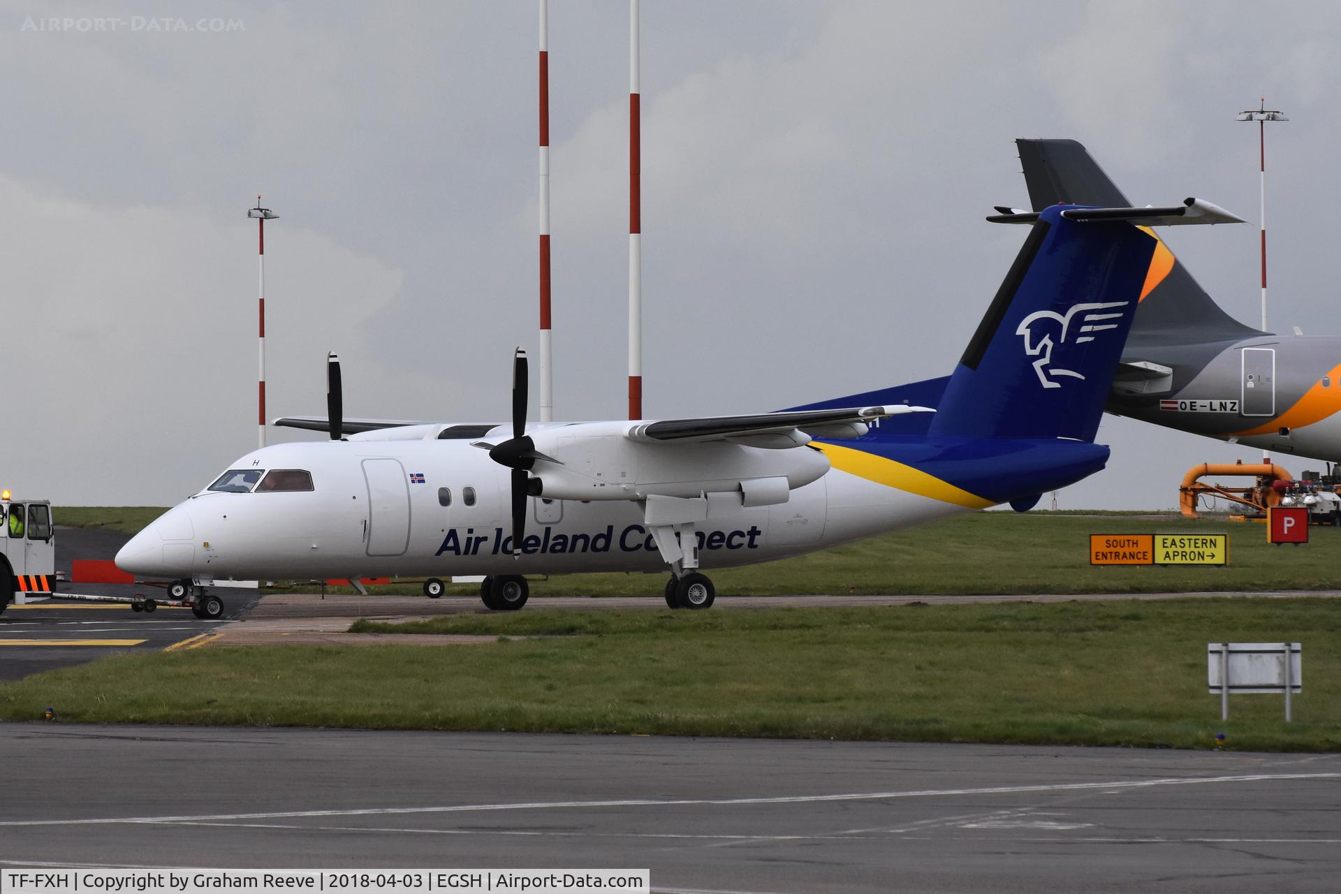 TF-FXH, 1997 De Havilland Canada DHC-8-202 Dash 8 C/N 450, Under tow at Norwich, after a re-spray into Air Iceland Connect, colours.