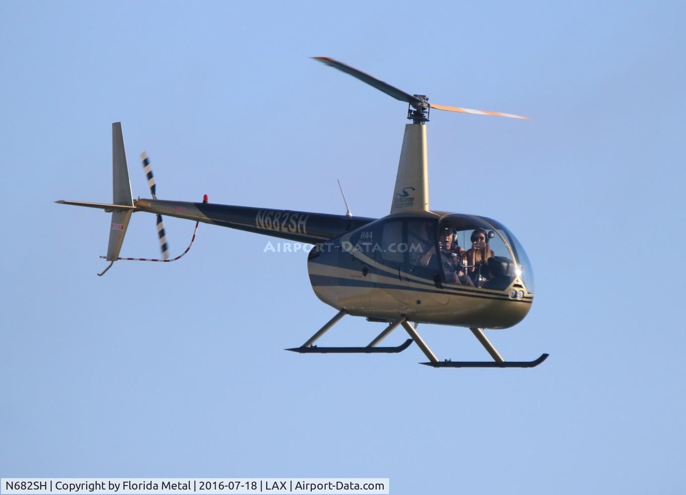 N682SH, 2001 Robinson R44 C/N 1013, Robinson R44 over Dockweiler Beach at the departure end of LAX