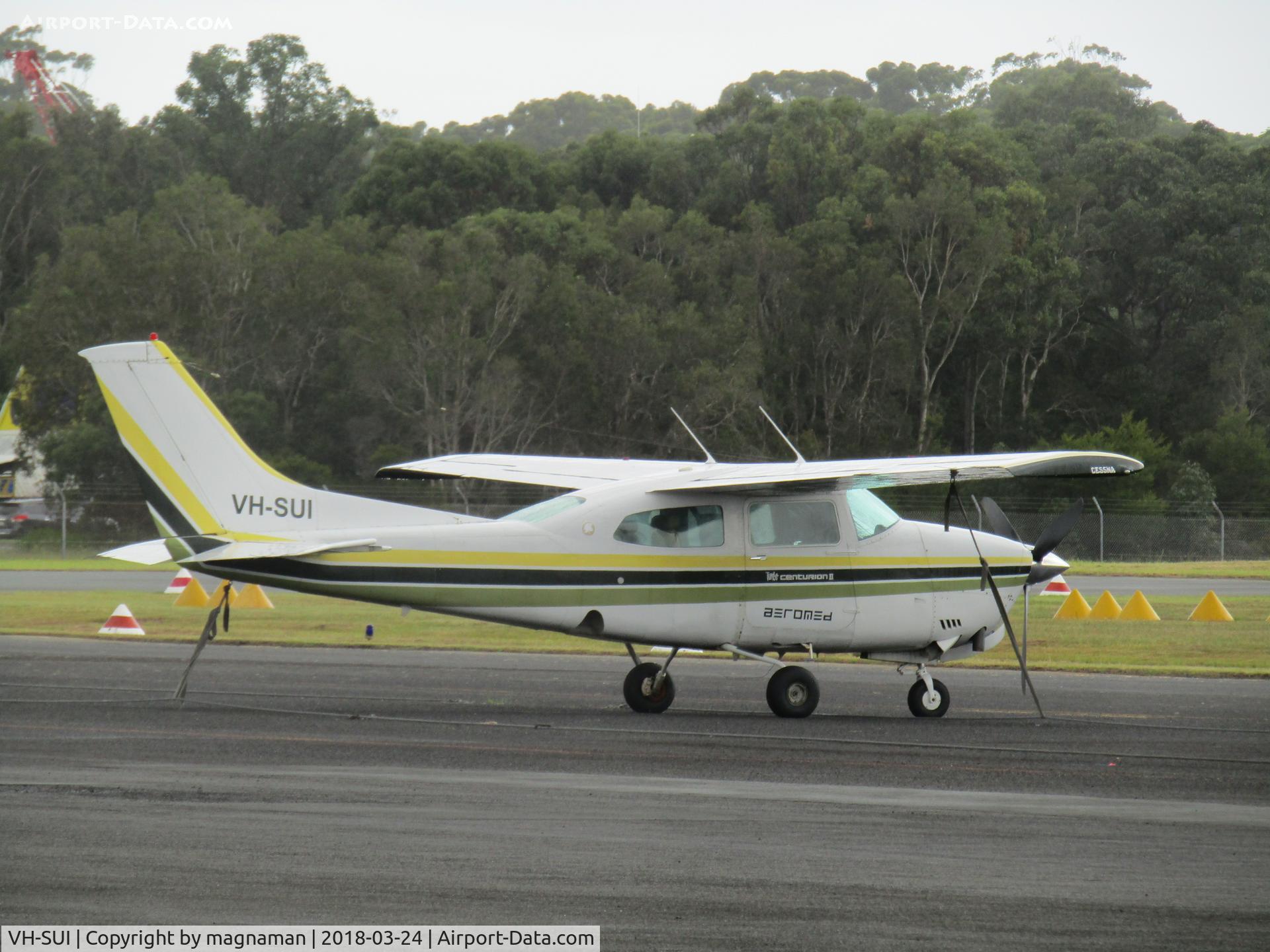 VH-SUI, Cessna T210N Turbo Centurion C/N 21063435, on apron in damp at caloundra