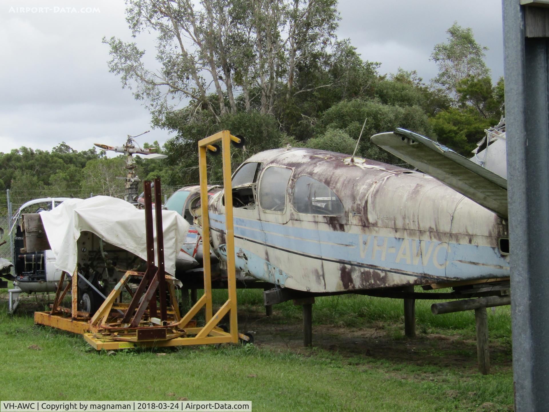 VH-AWC, 1963 Beech P35 Bonanza C/N D-7227, with bits of ZK-HCQ in far background and PK-ZHB hulk too. - at Caloundra Museum