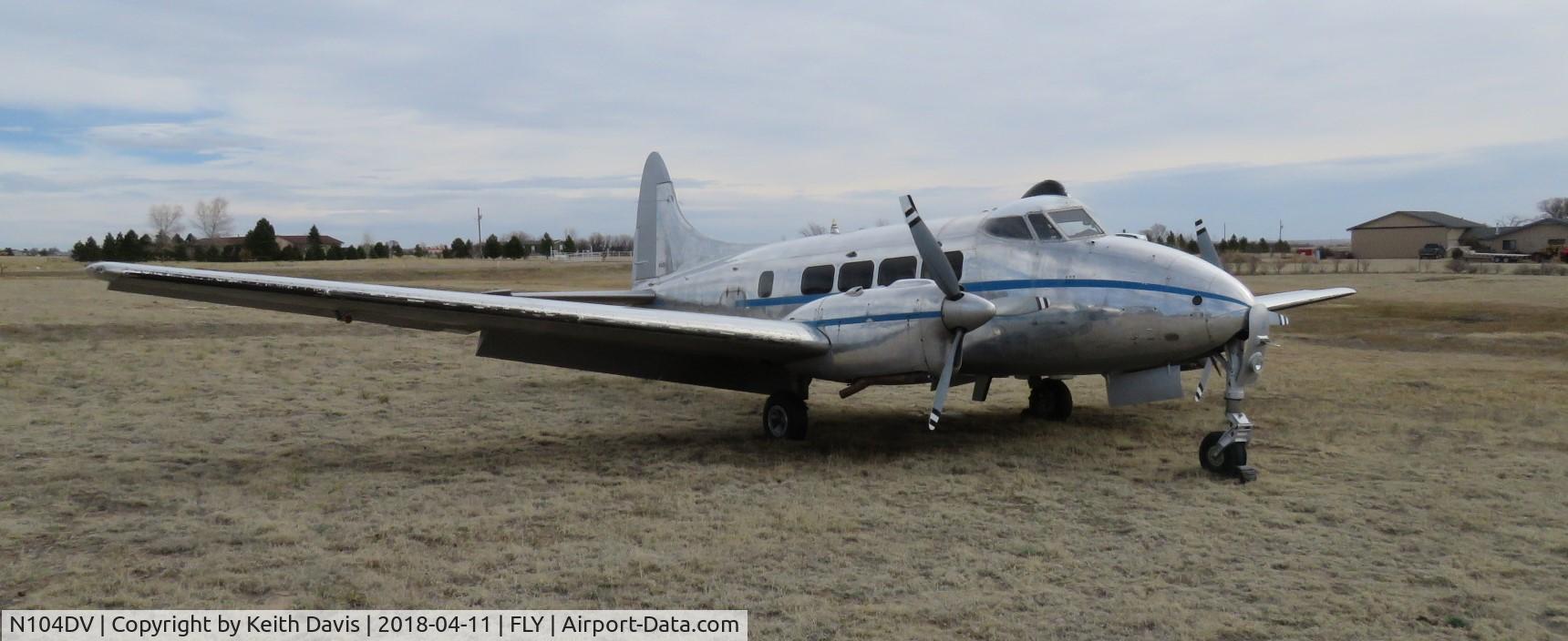 N104DV, 1961 De Havilland DH-104 Dove 6 C/N 04514, Parked in a field near Meadow Lake Airport, CO.