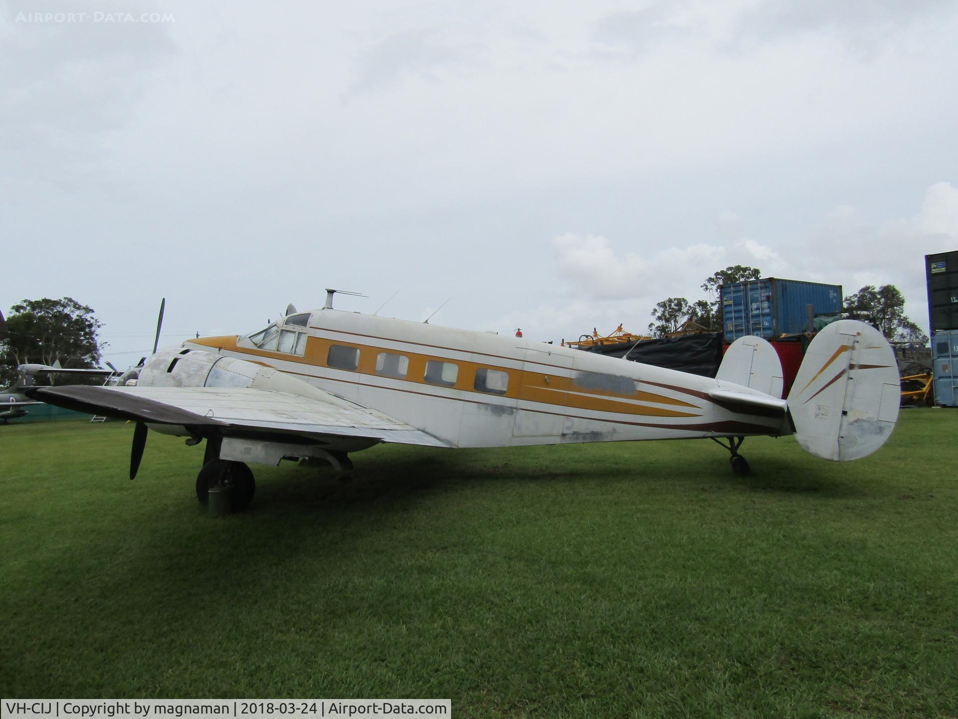 VH-CIJ, 1958 Beech E18-S C/N BA-81, At Caloundra Museum on a grey day
